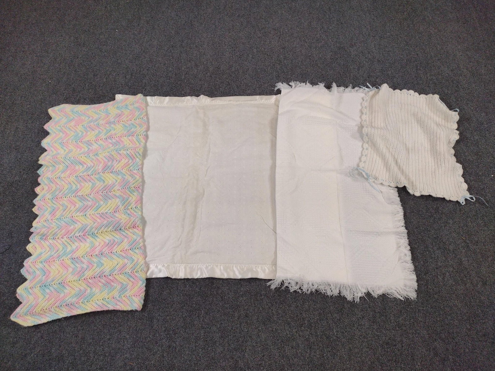 4 Childs Blankets: Small 24" long X 20" wide. Large 44" long X 38" wide.