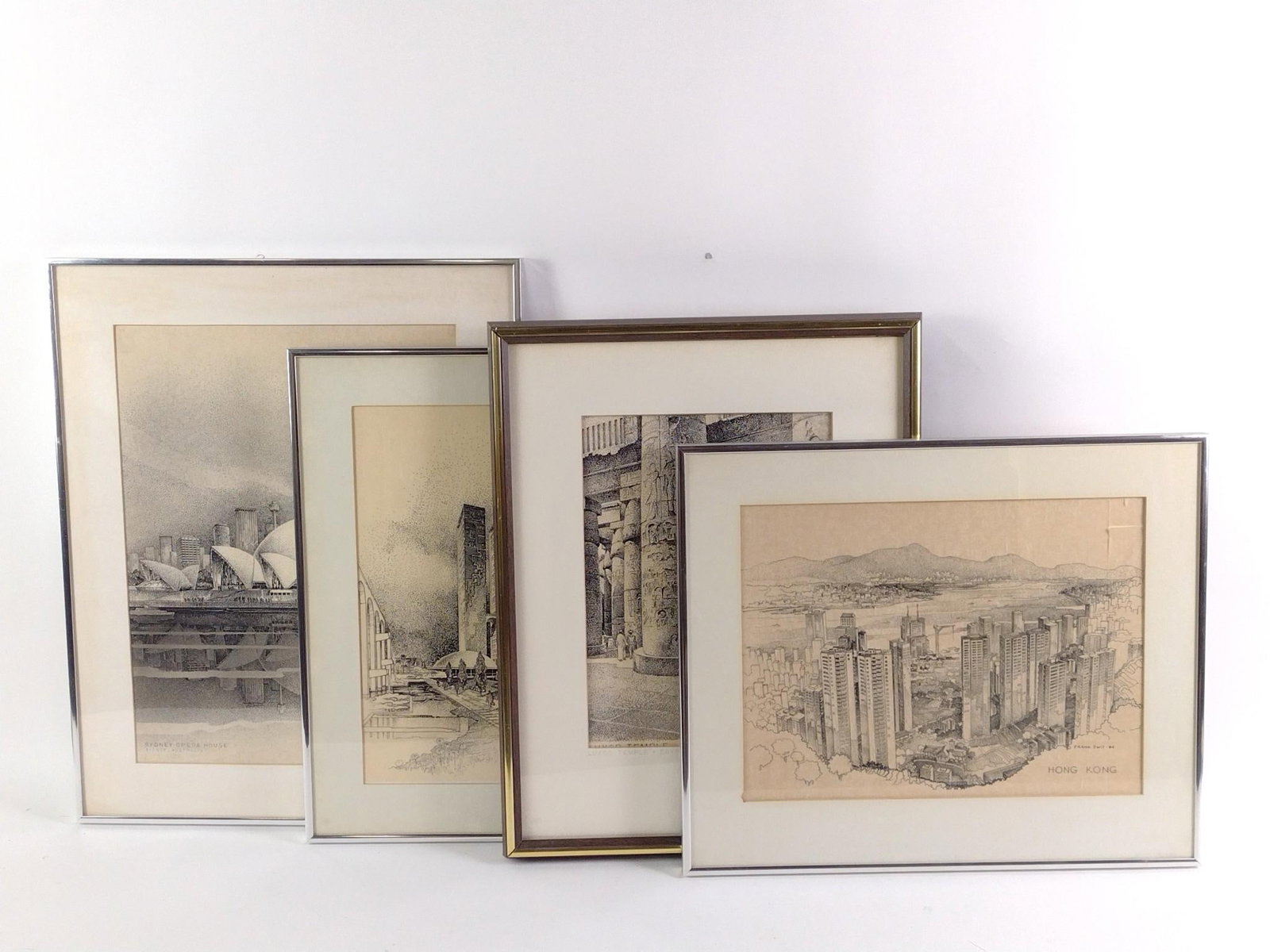 4 Framed World Tourist Site Drawings incl. Sydney Opera House: Also includes Hong Kong, Luxor Temple, and Brasilia. All drawn and signed by Frank Swit. Overall 15-1/4" to 9-1/4" long x 17-1/4" to 18-1/4" wide, sight 10-3/4" to 16-1/4" long x 12-1/4" to 13-3/4"