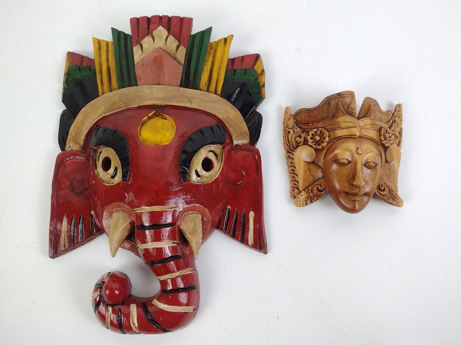 2 Carved Masks Incl. Ganesha: Large 15" high X 10" wide. Small 6" wide X 5-1/2" wide.