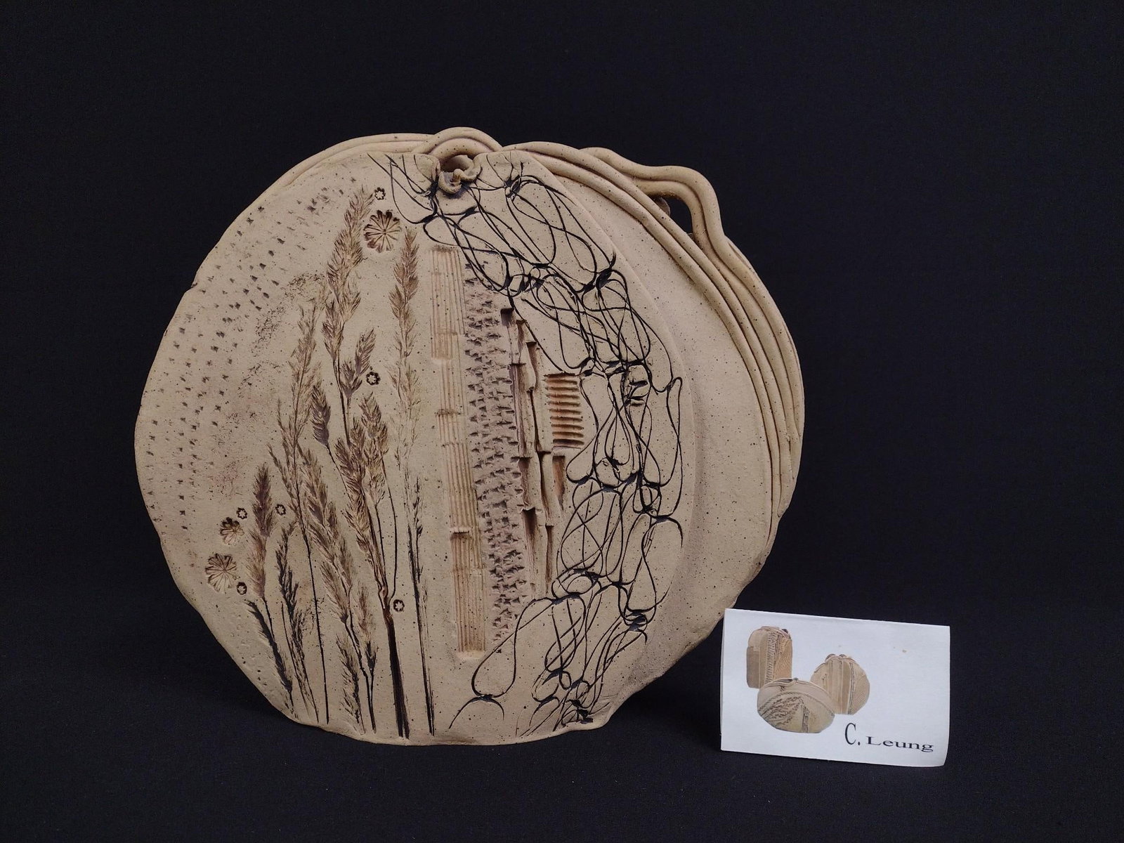 C. Leung Textured Studio Pottery: 10" wide X 3" deep X 8-3/4" high.