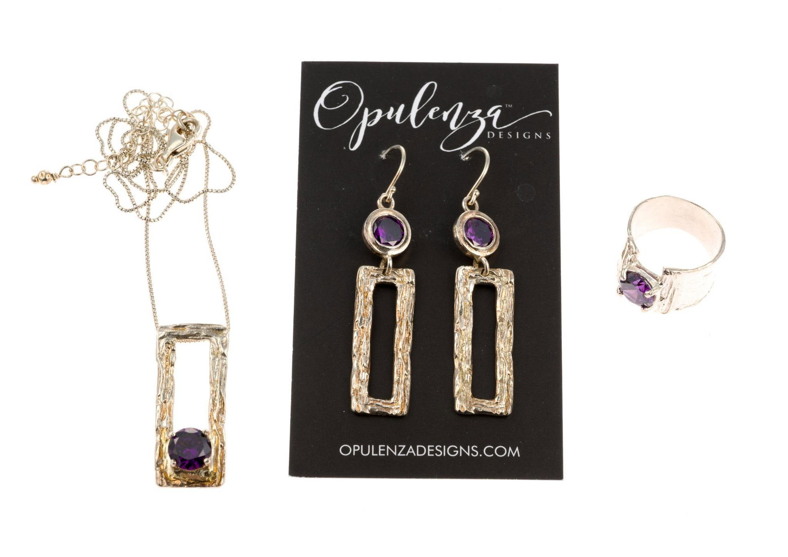 Opulenza Sterling Silver Jewelry Suite: Necklacee, earrings, and ring set. All marked. Earrings measure 5/8" wide x 2-1/4" long. Necklace measures 5/8" wide x 1-1/4" long, chain 18" long. Ring size 6. 0.56 ozt total.