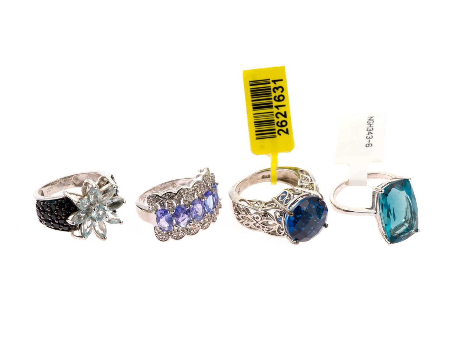 4 Sterling Silver Rings: All marked. Includes black spinel & aquamarine. Ring sizes 5 to 6. 0.68 ozt total.