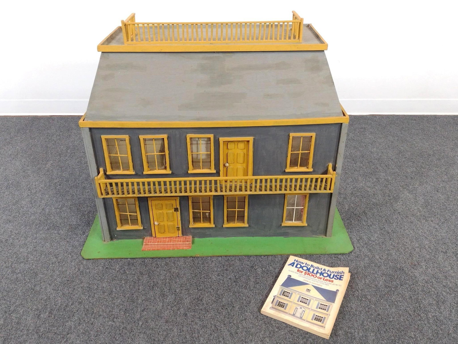 Vintage Handmade Dollhouse and Manual: Dollhouse measures 40" long by 20" wide by 33" high.
