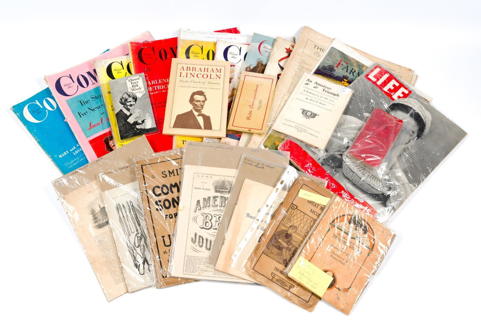 Collection of Vintage Ephemera: 12 magazines from 1910 to 1955 and includes Womens Home Companion, Life and Farmers Wife. Also includes 10 little manuals.