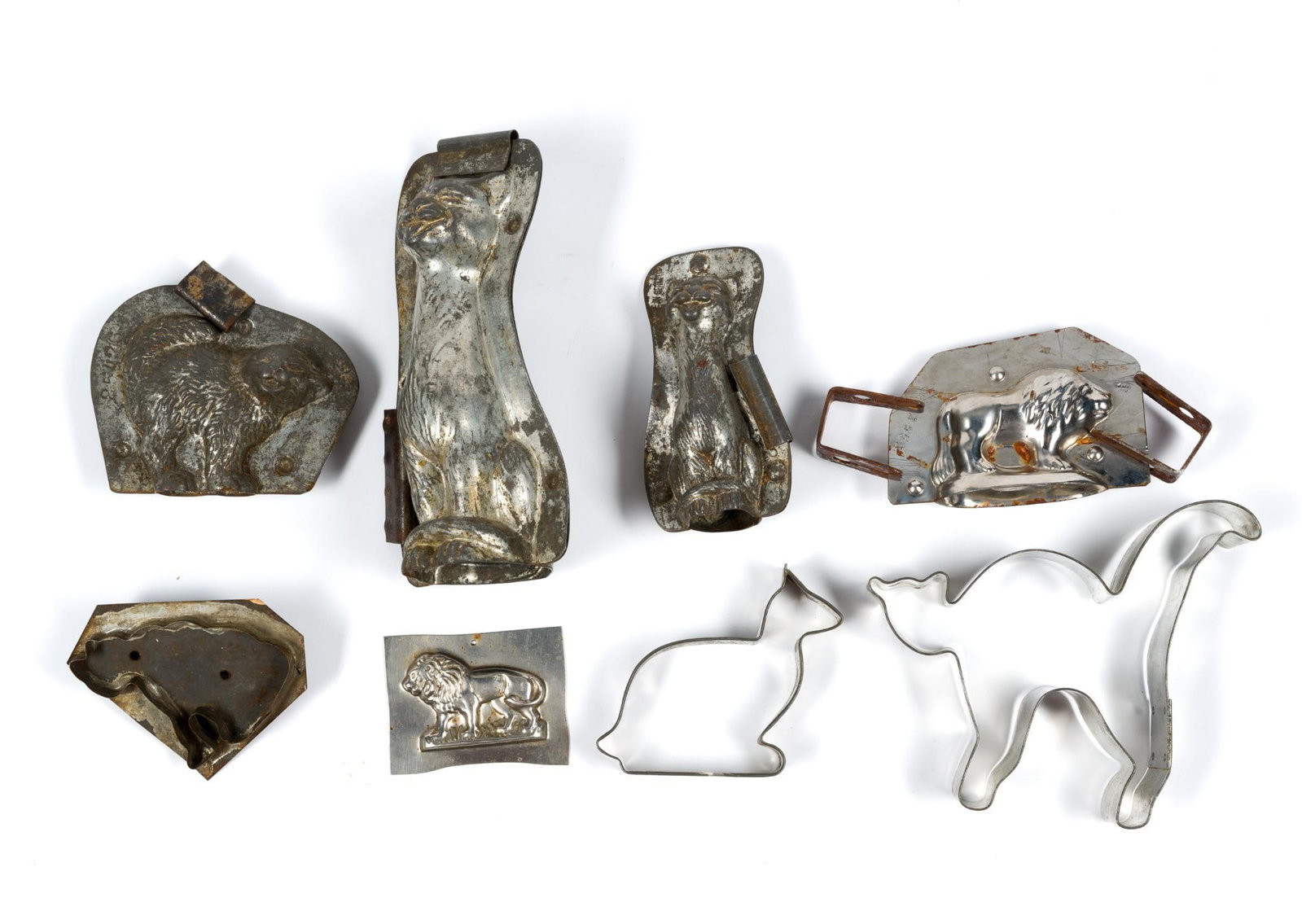 3 Tin Cat Cookie Cutters and 5 Antique Chocolate Molds: Largest piece measures 6 - 3/4" by 3 - 1/2".