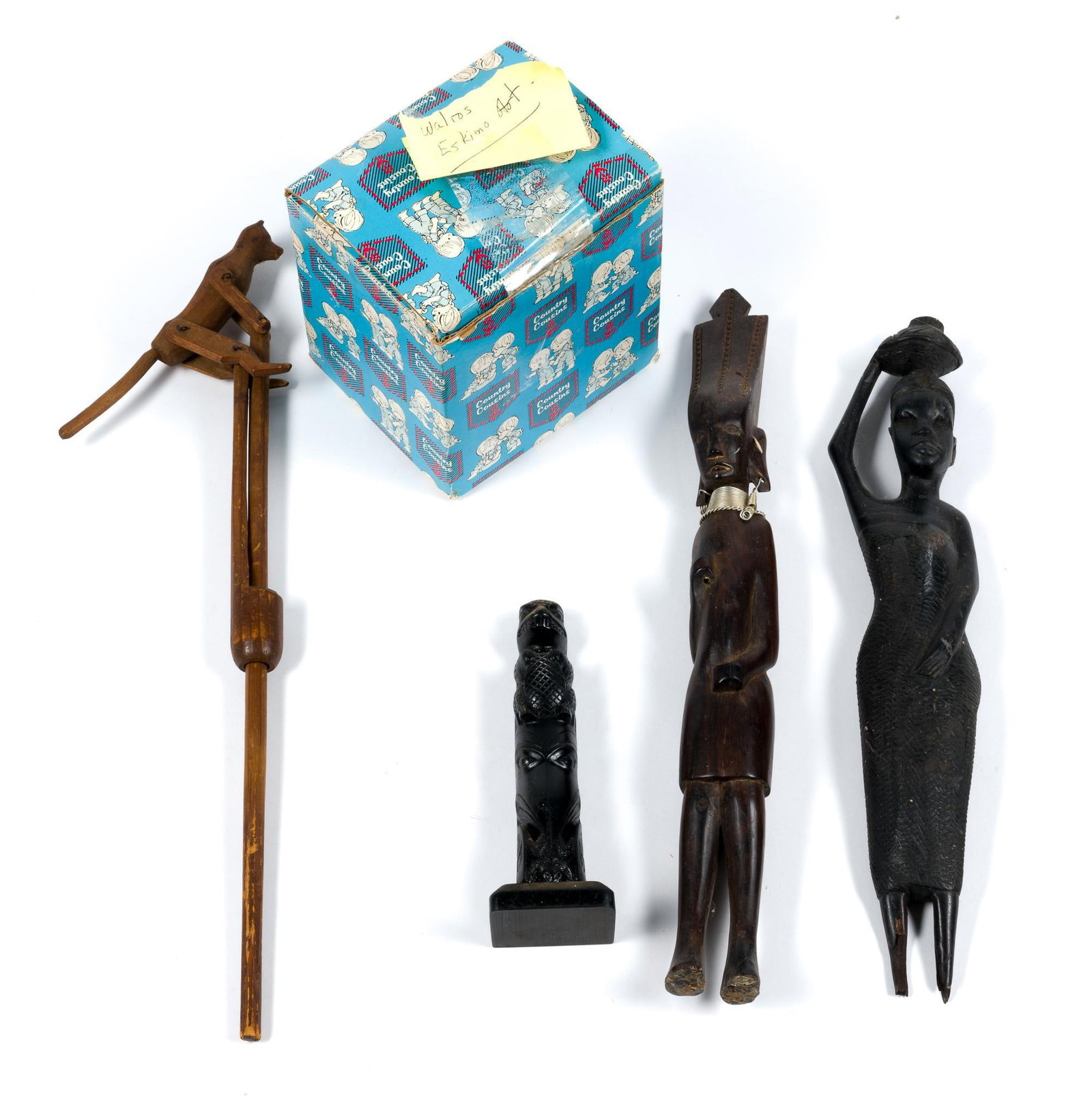 Wooden Statues and Antique Folk Art: Includes two African statues, a walrus statue, a small totem pole with a raven and a beaver on it, as well as a a hand-held vintage folk art acrobat.