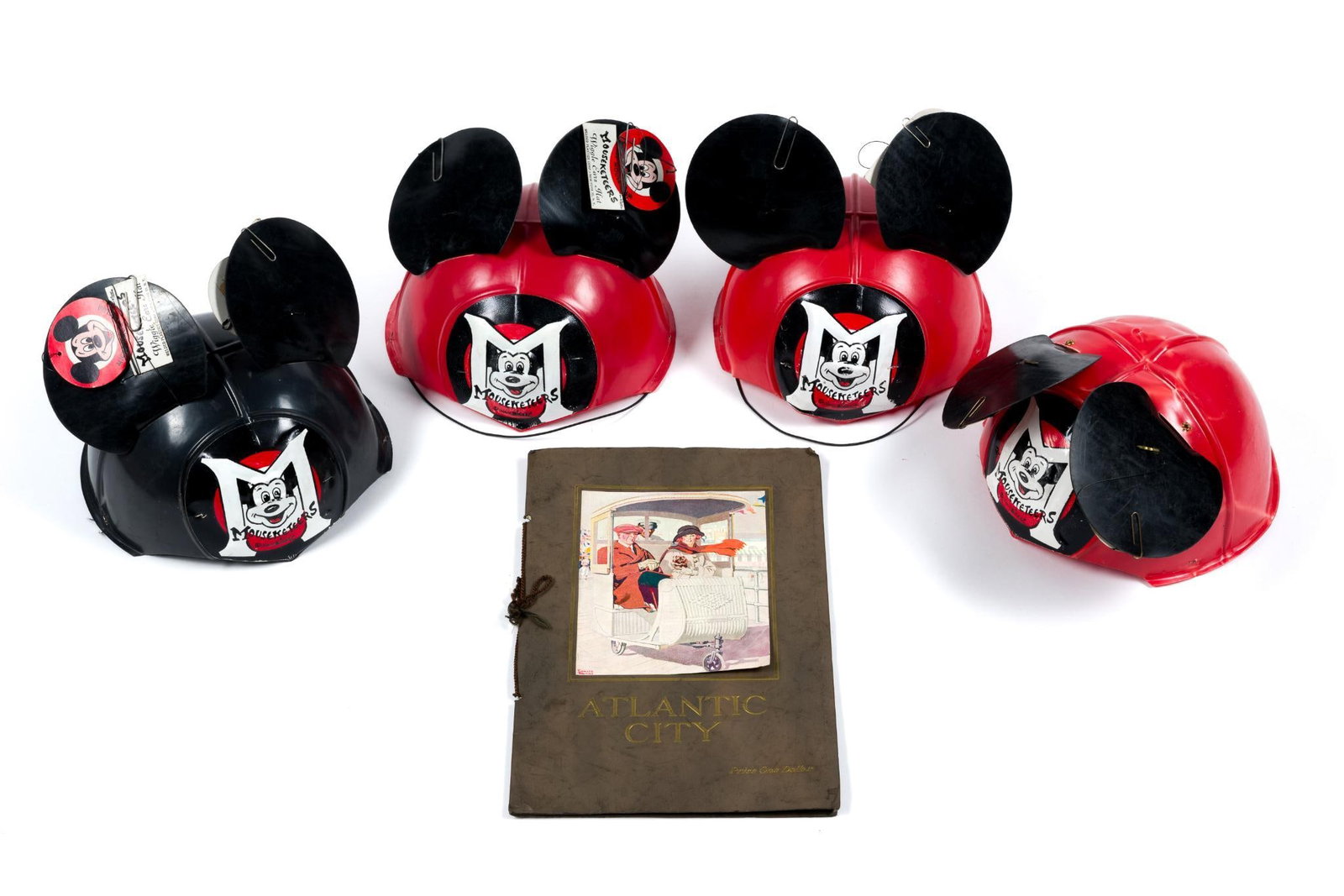 4 Mouseketeer Wiggle Ears Hat & Antique Atlantic City Booklet 1922: Book measures 10 - 1/2" by 7-1/4". Mickey Mouse Club Mouseketeers Wiggle Ears Hat, by Welded Plastics Corp. New York 35, NY, plastic with original hang tags, 6-1/2" high by 7-1/2" across. 3 red and 1 