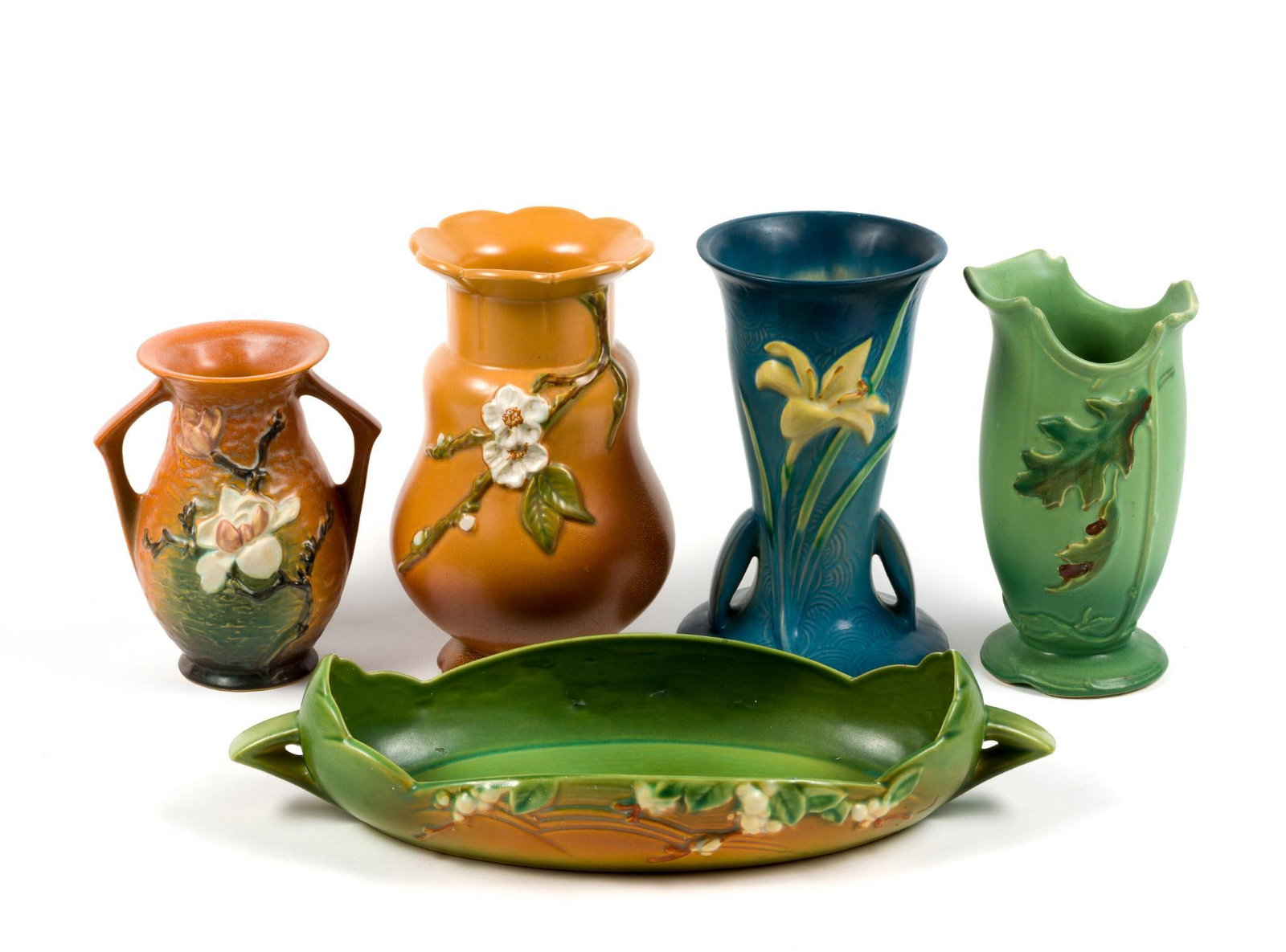 3 Roseville & 2 Weller Pottery: 2 Roseville vases including "Magnolia" pattern, 2 Weller pottery vases and 1 Roseville pottery bowl (15 - 3/4" long) in the "Snowberry" pattern. Largest vase measures 9 - 1/2" x 5 - 1/4".
