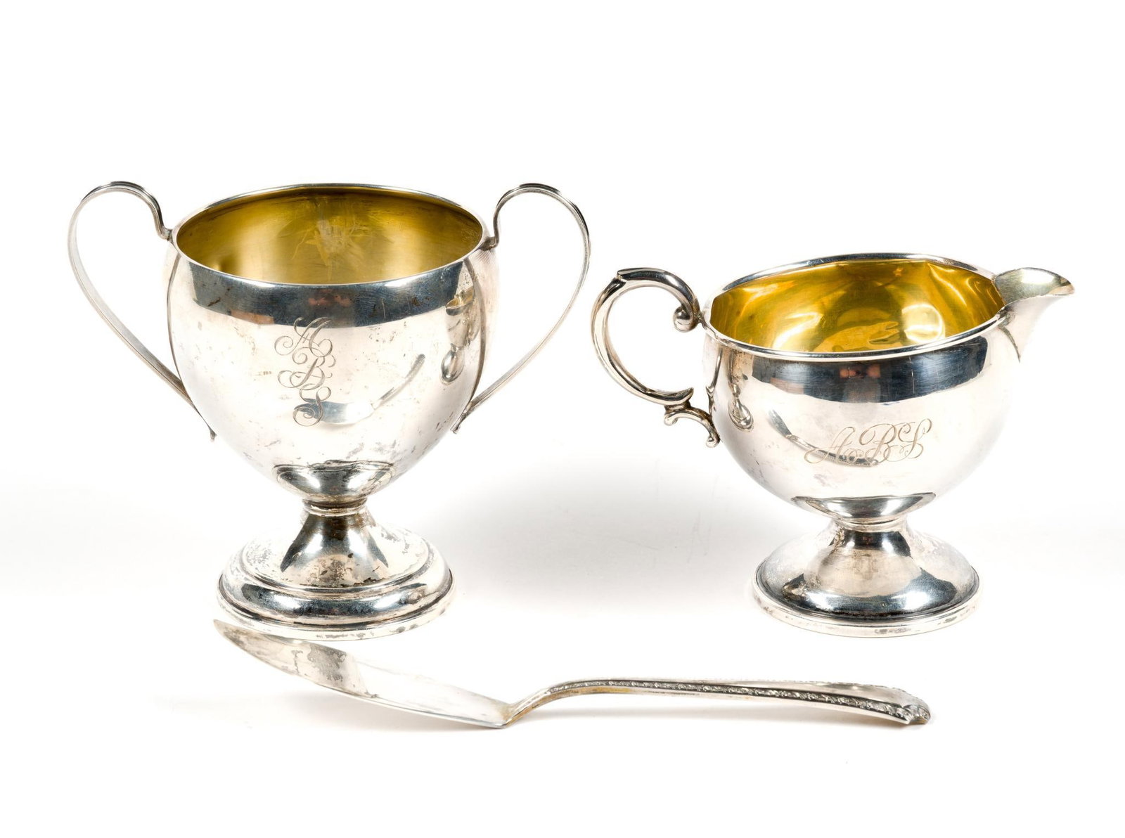 2 Weighted Sterling Silver Cups & Sterling Butter Knife: Cups measure 5 x 5 - 3/4". Weighs 8.16 ozt.