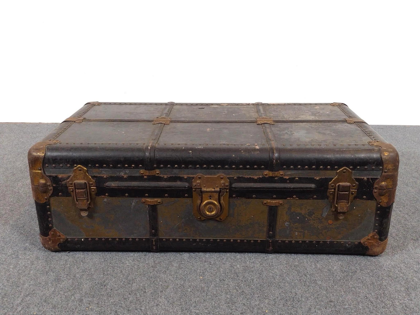 Vintage Steamer Trunk: 38-1/2" wide X 22" deep X 12-1/2" high. Has wear consistent with age.