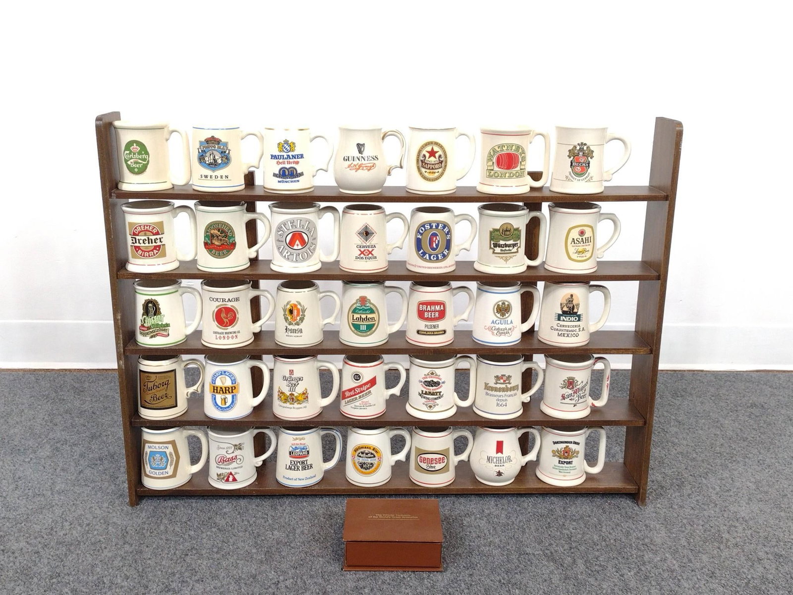 Tankards of the World's Great Breweries with Display Shelf: Miniature mugs measure 4" x 3 - 1/2" and the shelf measures 28 - 3/4" x 21 - 1/4" x 3 - 1/2".