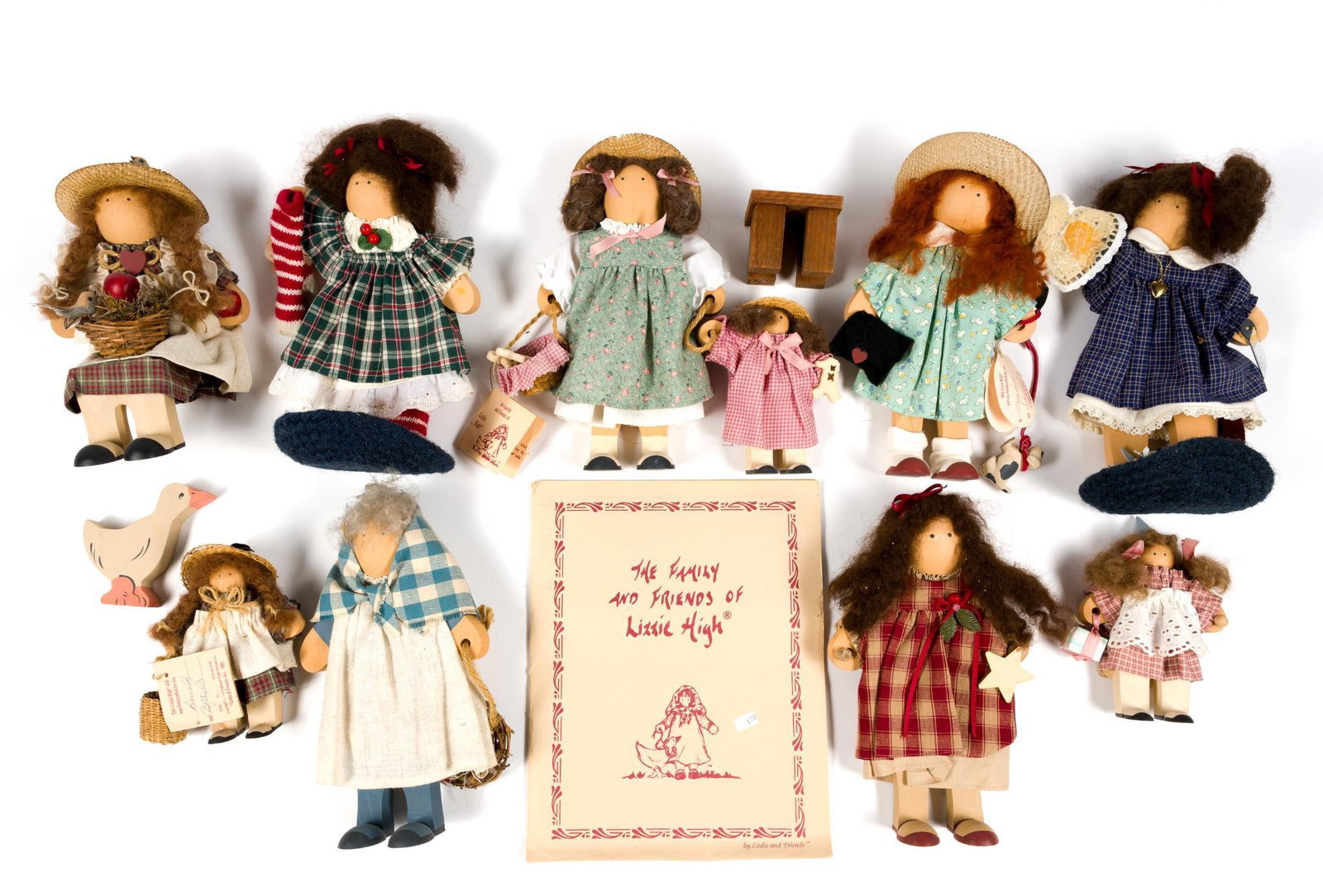 9 Lizzie High Dolls and Wooden Duck: Largest measures approximately 11" long.