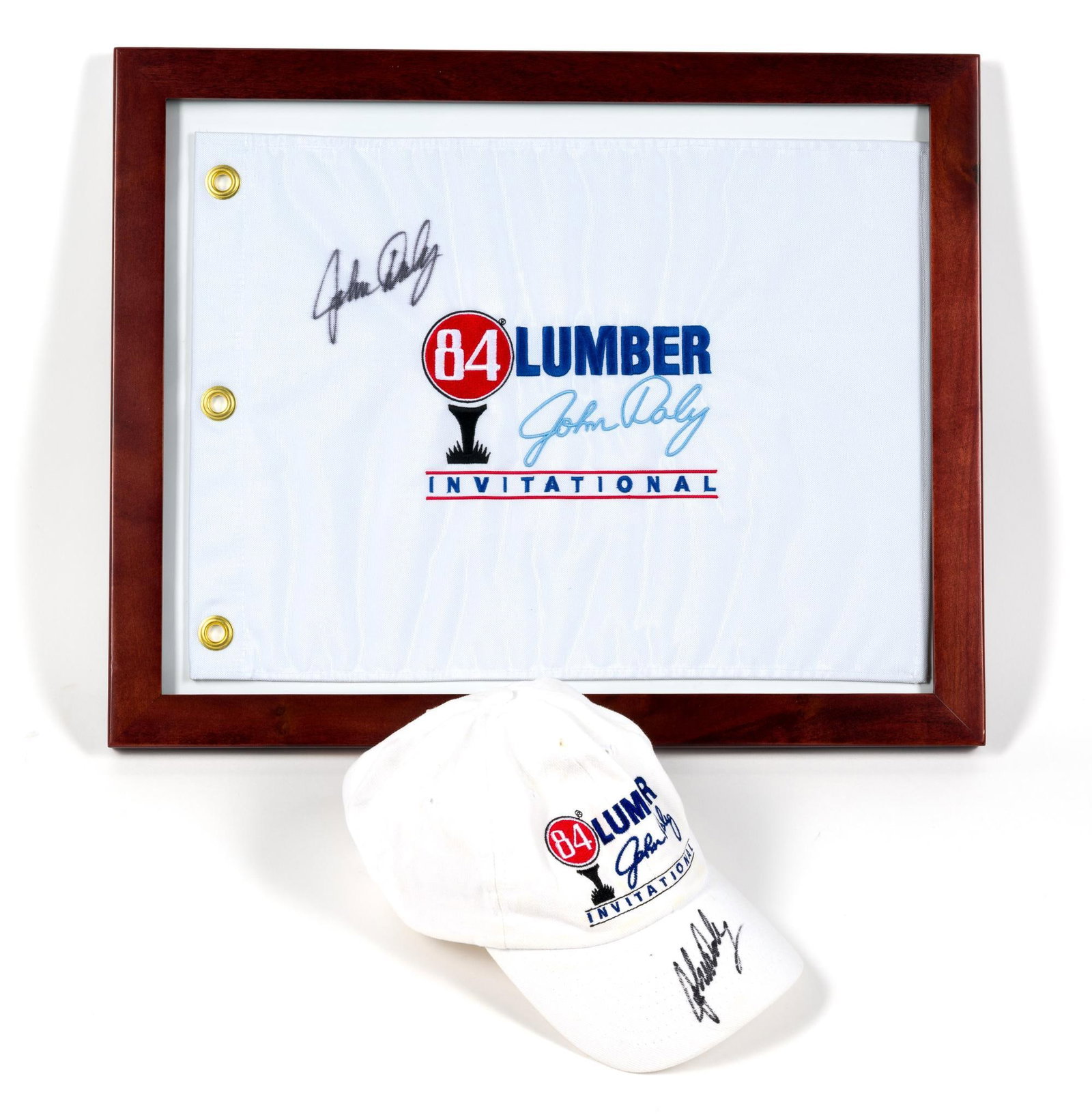 John Daly Autographed Hat & Flag: Both feature John Daly's signature. Flag and hat are from 84 Lumber Invitational. Flag is framed, frame measures 16" x 20".