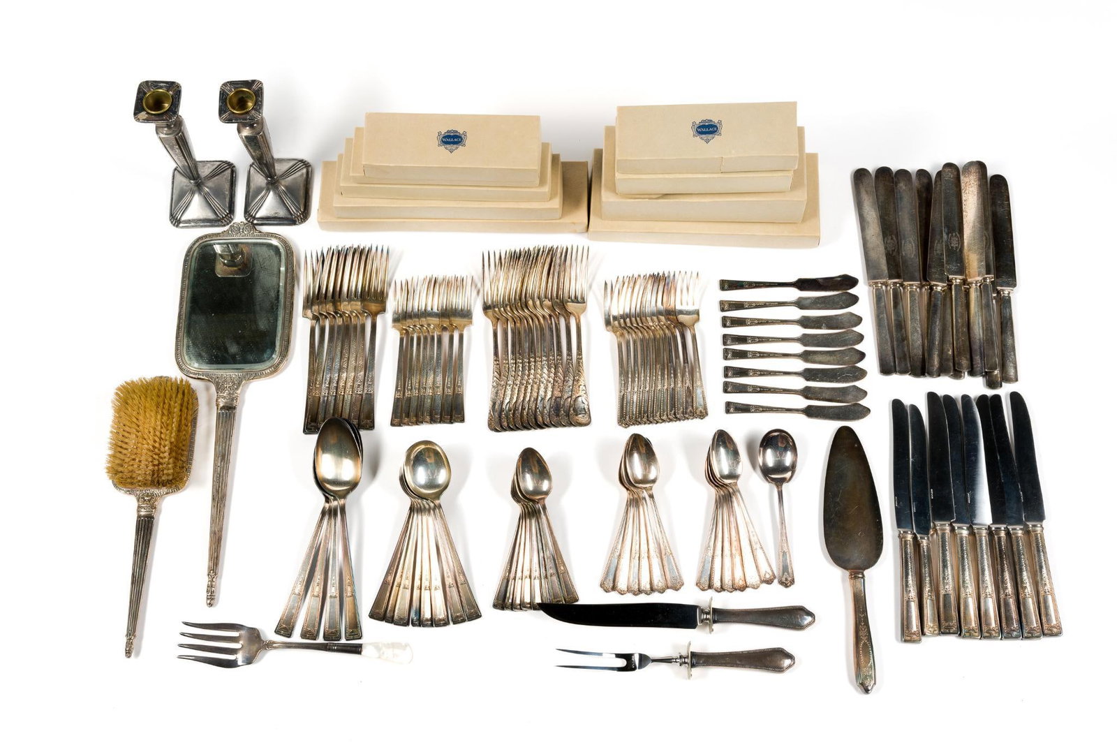 Vintage Silverplate: Includes partial dresser set vintage mirror (4 - 5/8" wide x 16" long) and brush, candle sticks, carving forks and knives, and flatware.