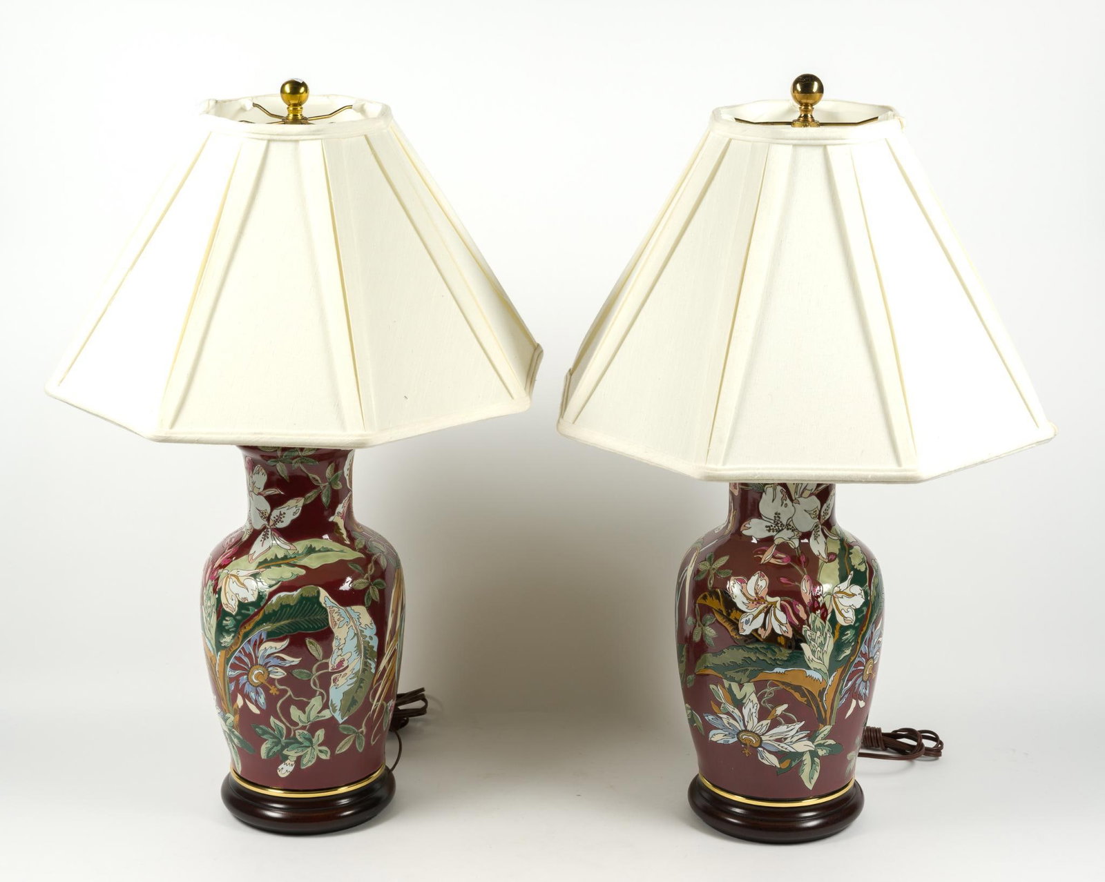 Pair of Red Chinoiserie Table Lamps: Each measures 8" x 22 - 1/2" x 8" without the shade. One shade has a sizable rip on the inside of the lamp shade.
