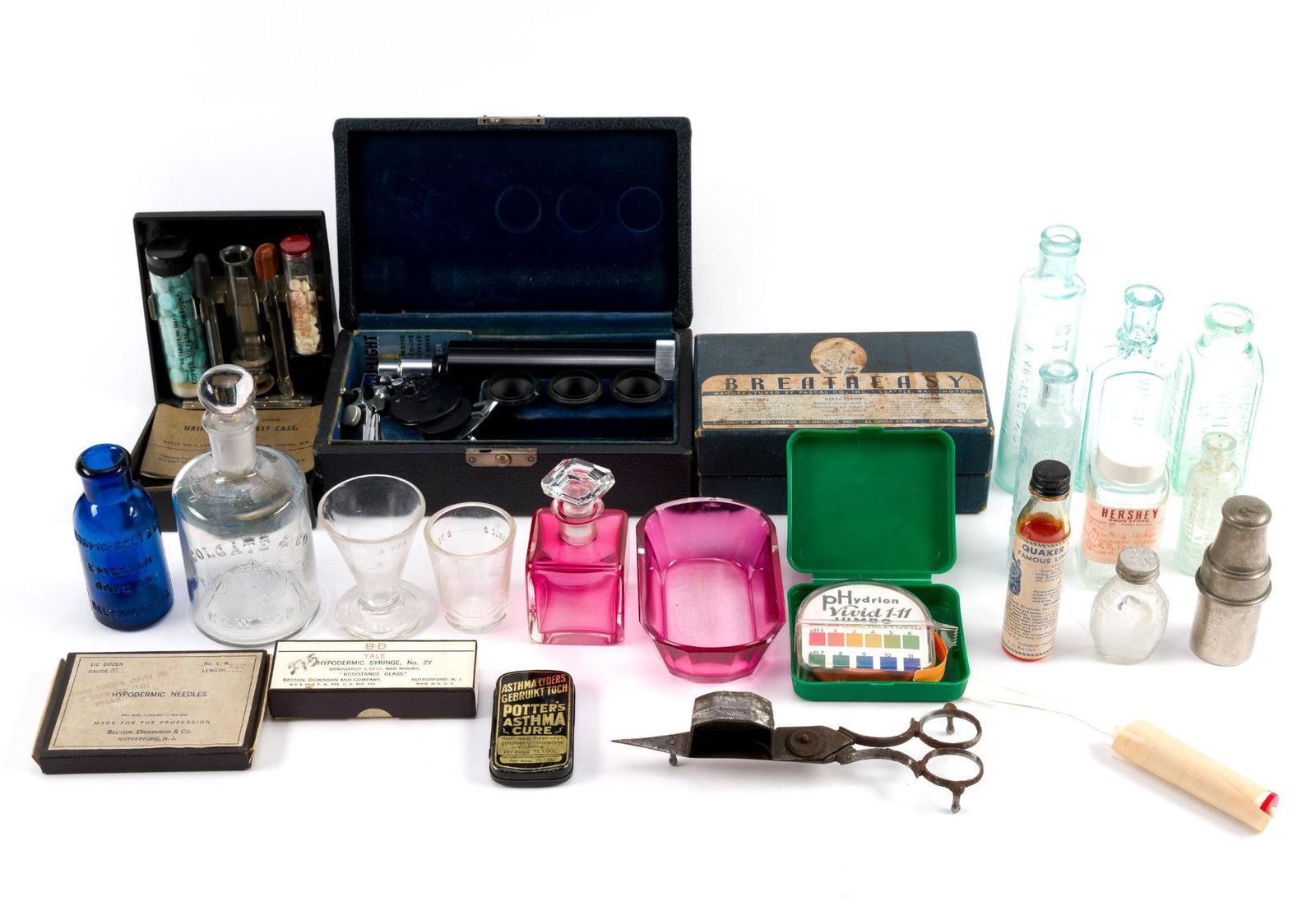 Antique Medical Devices & Bottles: Includes a Bausch & Lomb opthalmoscope, Sheftel urine sugar test, and a "Breatheasy" inhaler. Largest box measures 8 - 1/4" x 2 - 3/4" x 4 - 3/4"..