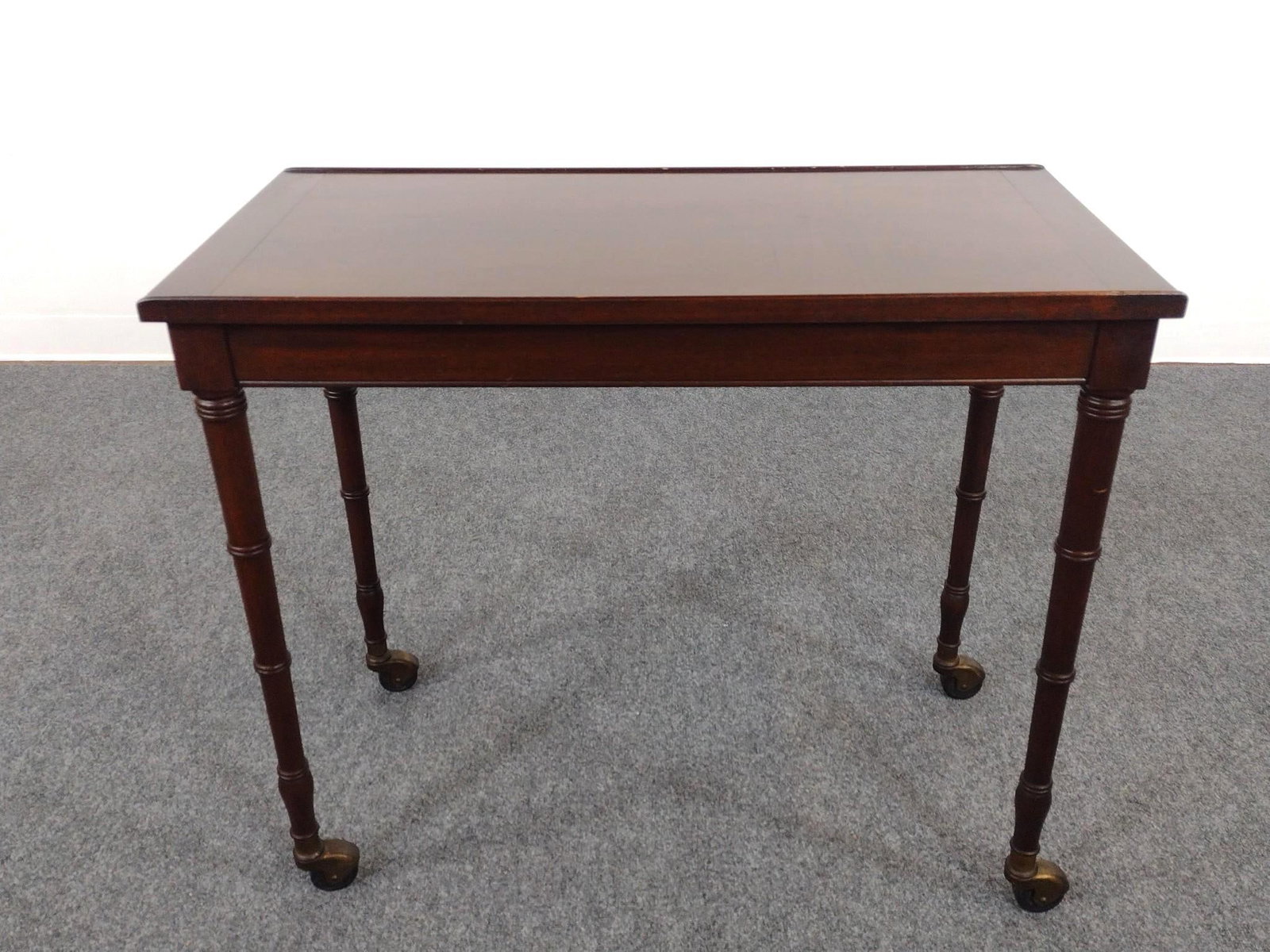 Rolling Book Stand: 32" wide X 16" deep X 27-1/2" high. Has a few light scratches.