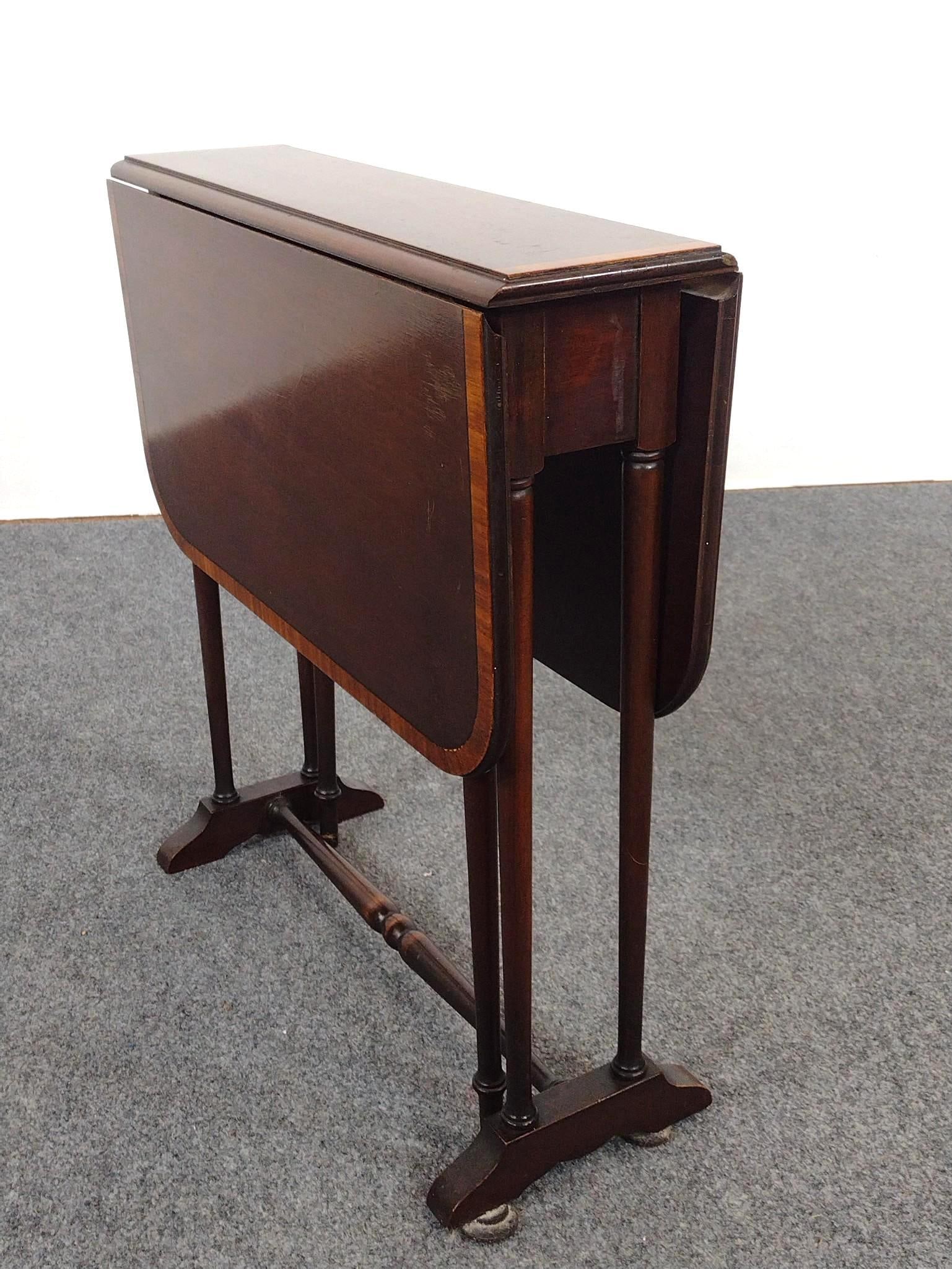 Ferguson Small Drop Leaf Side Table: Open 28", closed 6-3/4" wide X 22-1/2" deep X 24-1/2" high. Top has some finish loss.