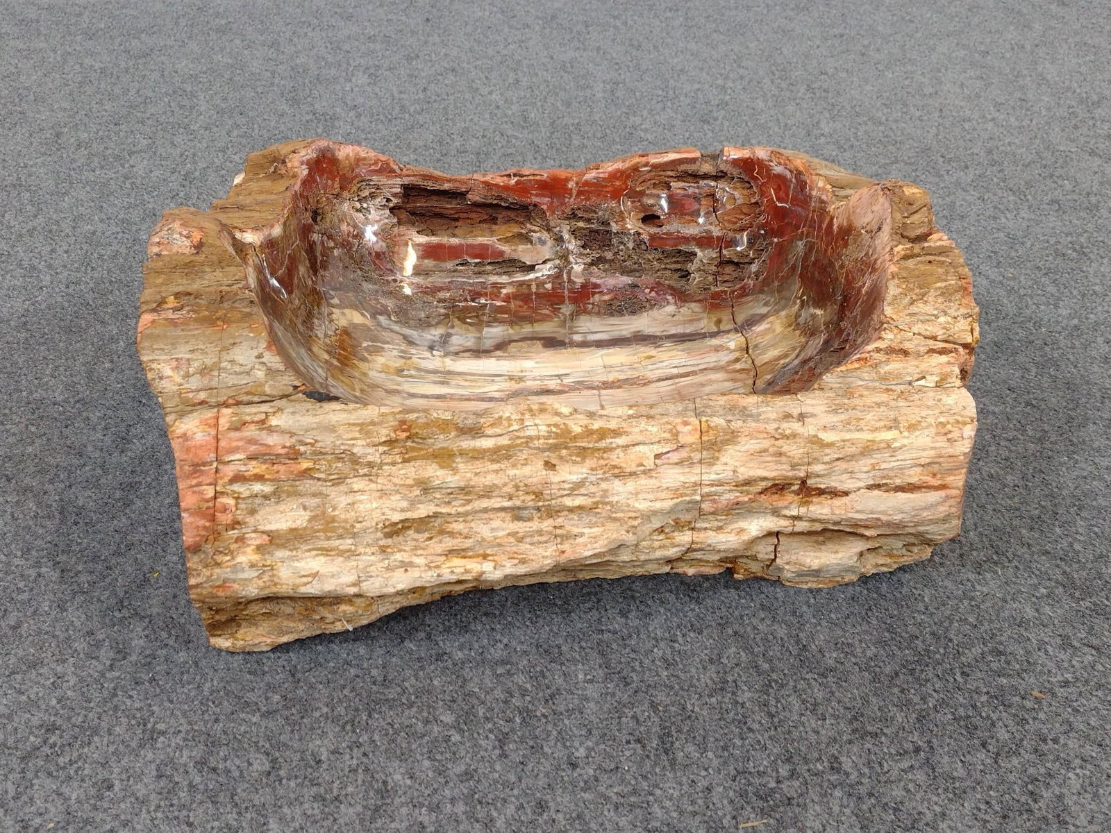 Madagascar Petrified Wood Bowl: Has a large crack through the middle of the bowl that has been repaired with glue. Carrying crate measures 21" x 9 - 1/2" x 17 - 1/2".