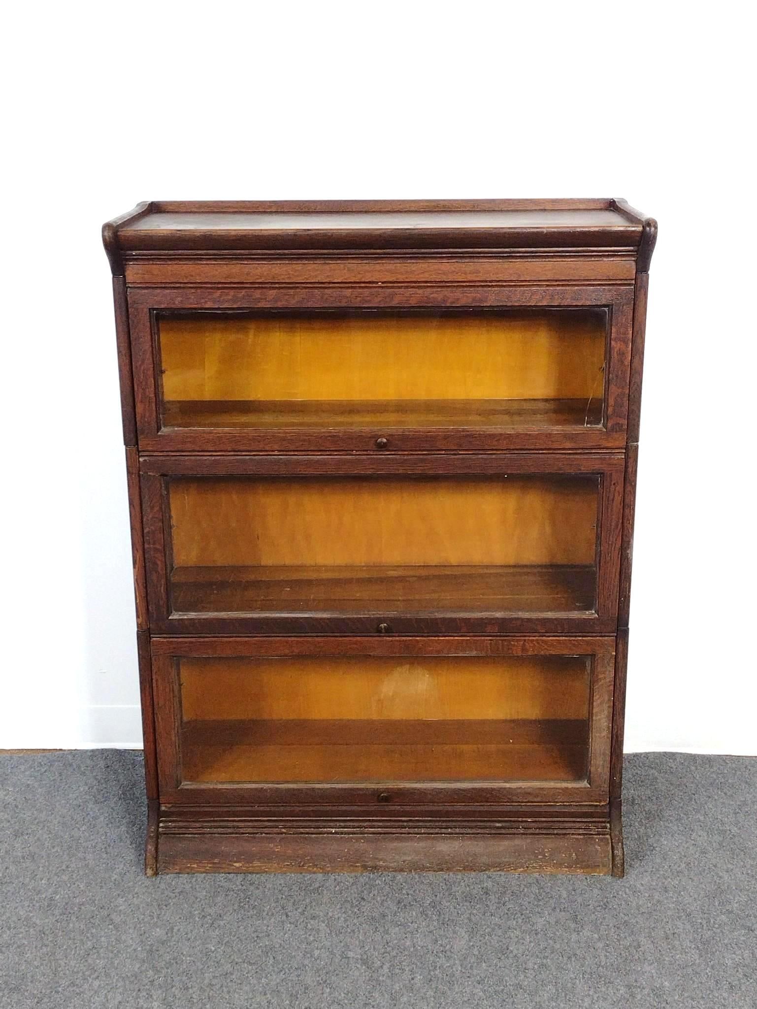 3 Tier Barrister Bookcase: 34-1/2" wide X 14-1/2" deep X 46-1/2" high. Has finish loss. Also has paint on one side.
