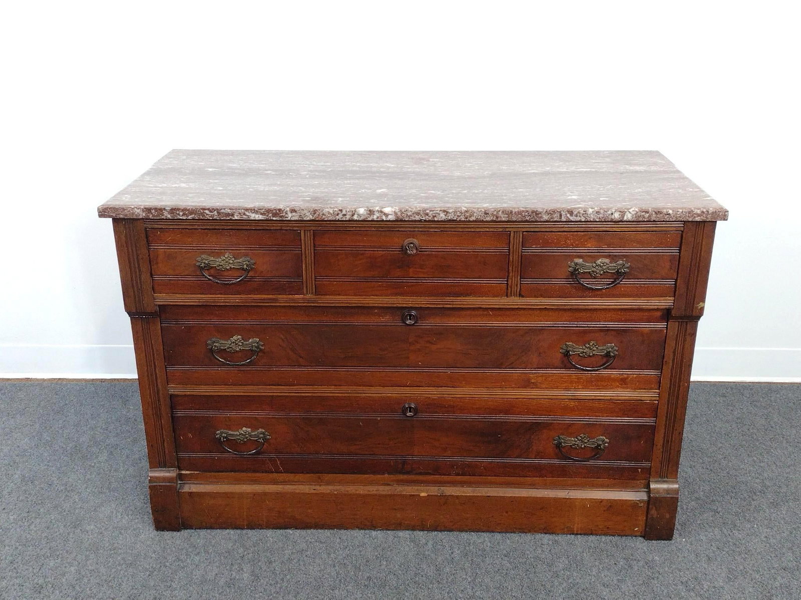 Victorian Eastlake Style Marble Top Dresser: 43-3/4" wide X 19" deep X 28" high. Has some scratches.