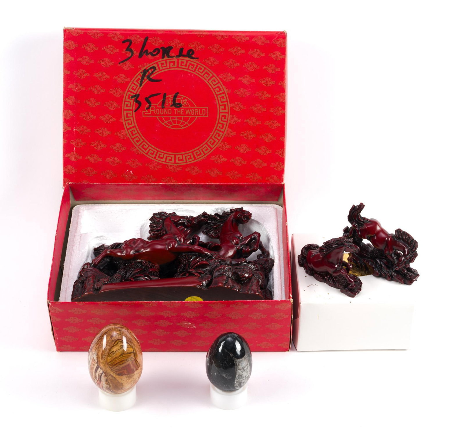 Vintage Chinese Statues & 2 Carved Eggs: Horse statue is known as representing "Feng shui" in the form of 3 galloping horses. Horse statues made out of red resin, and eggs are made of stone. Horse statue box measures 9 - 1/2" x 6 - 3/4" x 3 