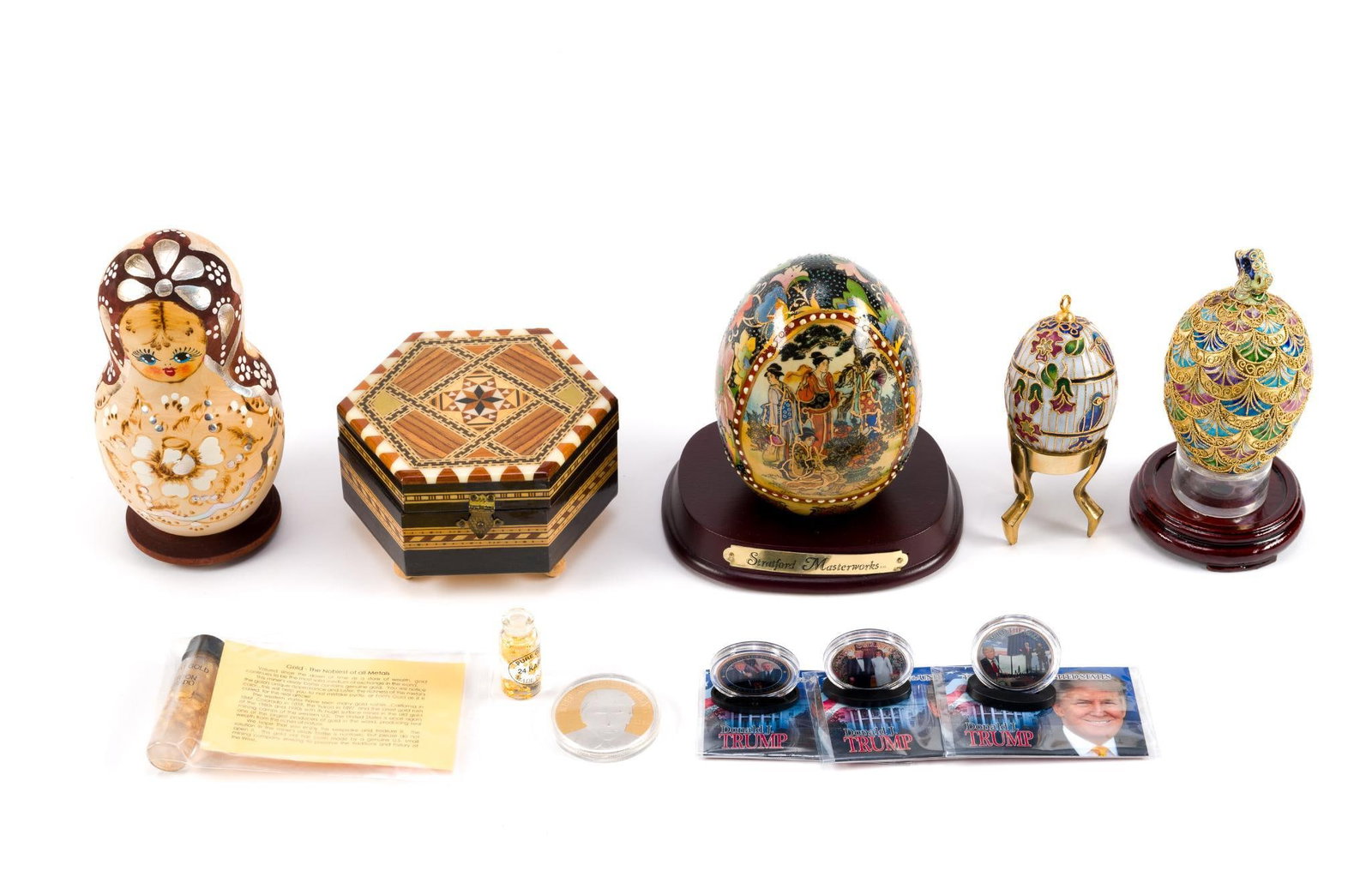 Faberge Style Eggs and Nesting Doll: Also includes a jewelry box, Trump coins and stands and more. Largest egg measures 3 - 1/2" x 5" x 3 - 1/2".