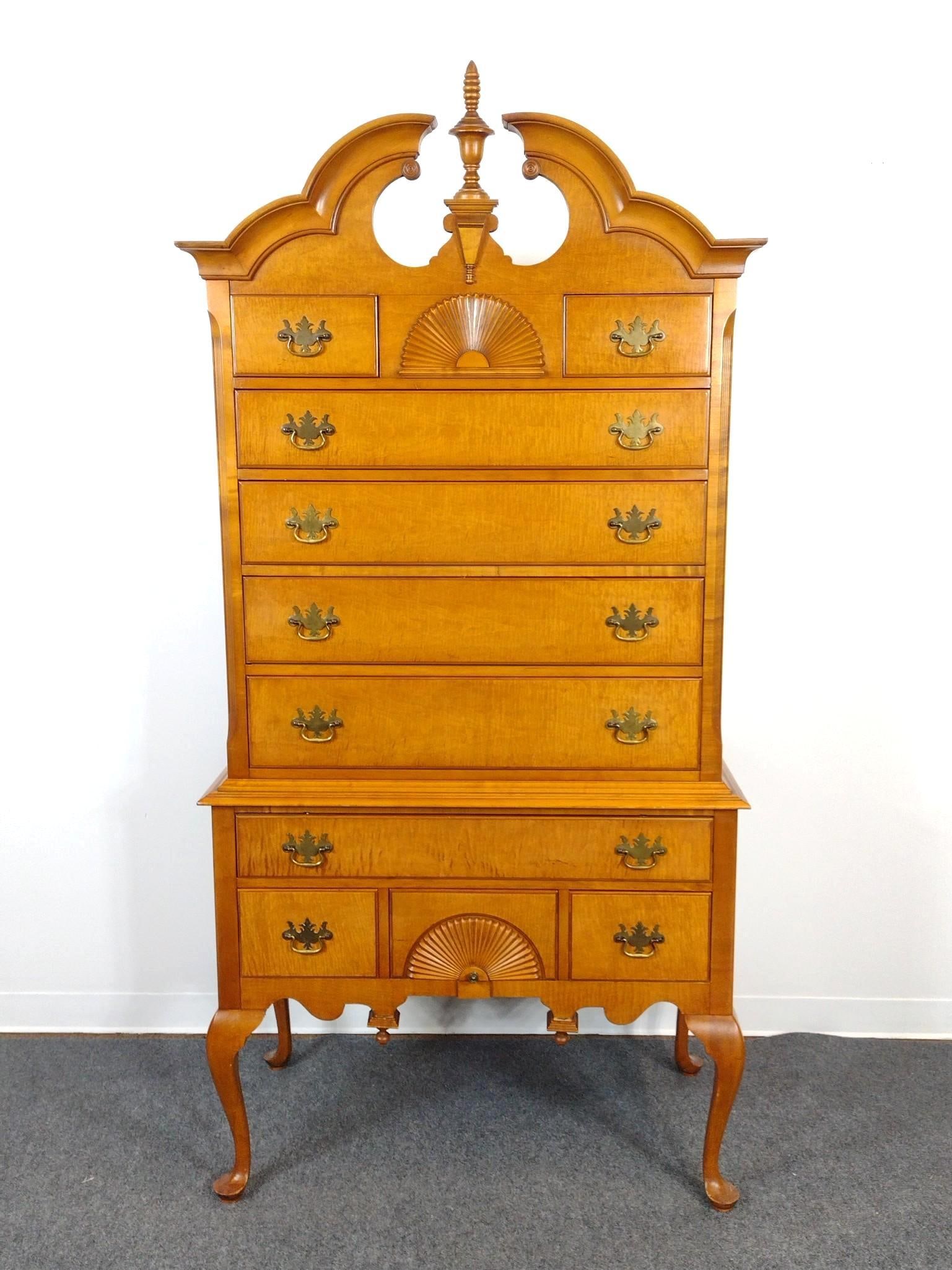 Queen Anne Style High Boy: Bonnet top with central finial. Shell carved accents. 39-3/4" wide X 21" deep X 82-1/4" high.
