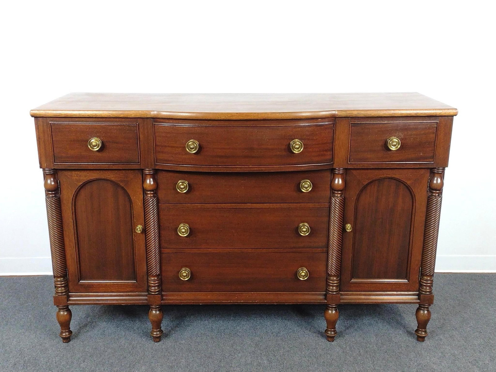 Bow Front Buffet or Sideboard: 64" wide X 22" deep X 40-1/4" high. Has some light scratches.