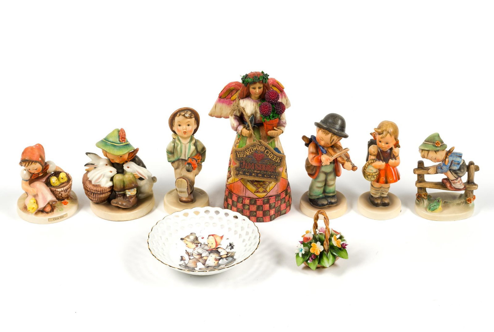 9 Decorative Figurines: Also includes Hummel plate, Hummel figurines, a Jim Shore angel figurine and others. Jim Shore angel measures 4" x 3 - 1/4" x 7 - 1/2".