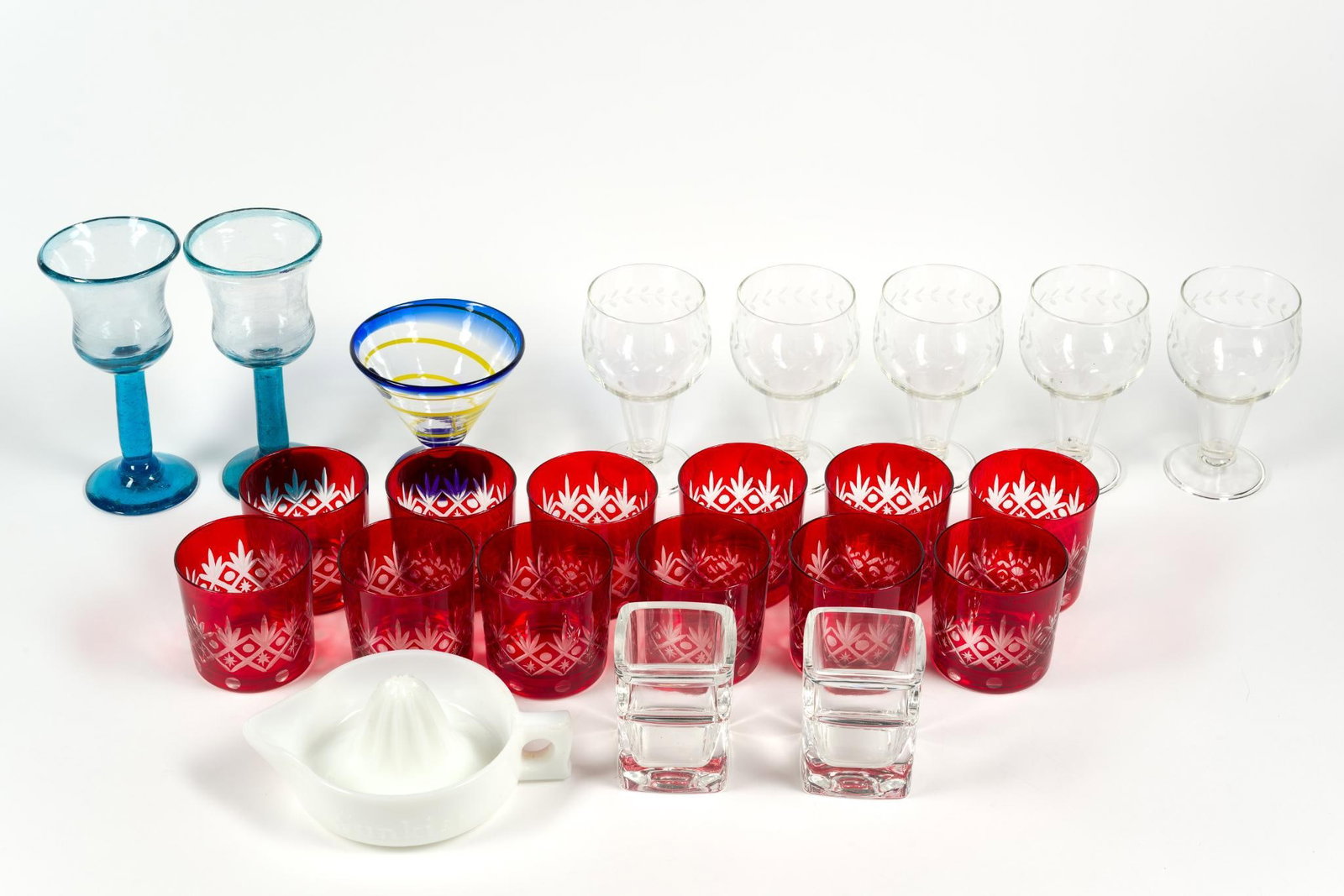 Glassware Incl. Ruby Cut to Clear: Includes stemless red cut Bavarian glass, hand blown cocktail glassware, ergonomic brandy glasses and Anchor Hocking wine goblets. Largest measures 4" x 8 - 1/4" x 4", red glass cups measure 3 - 1/2" 