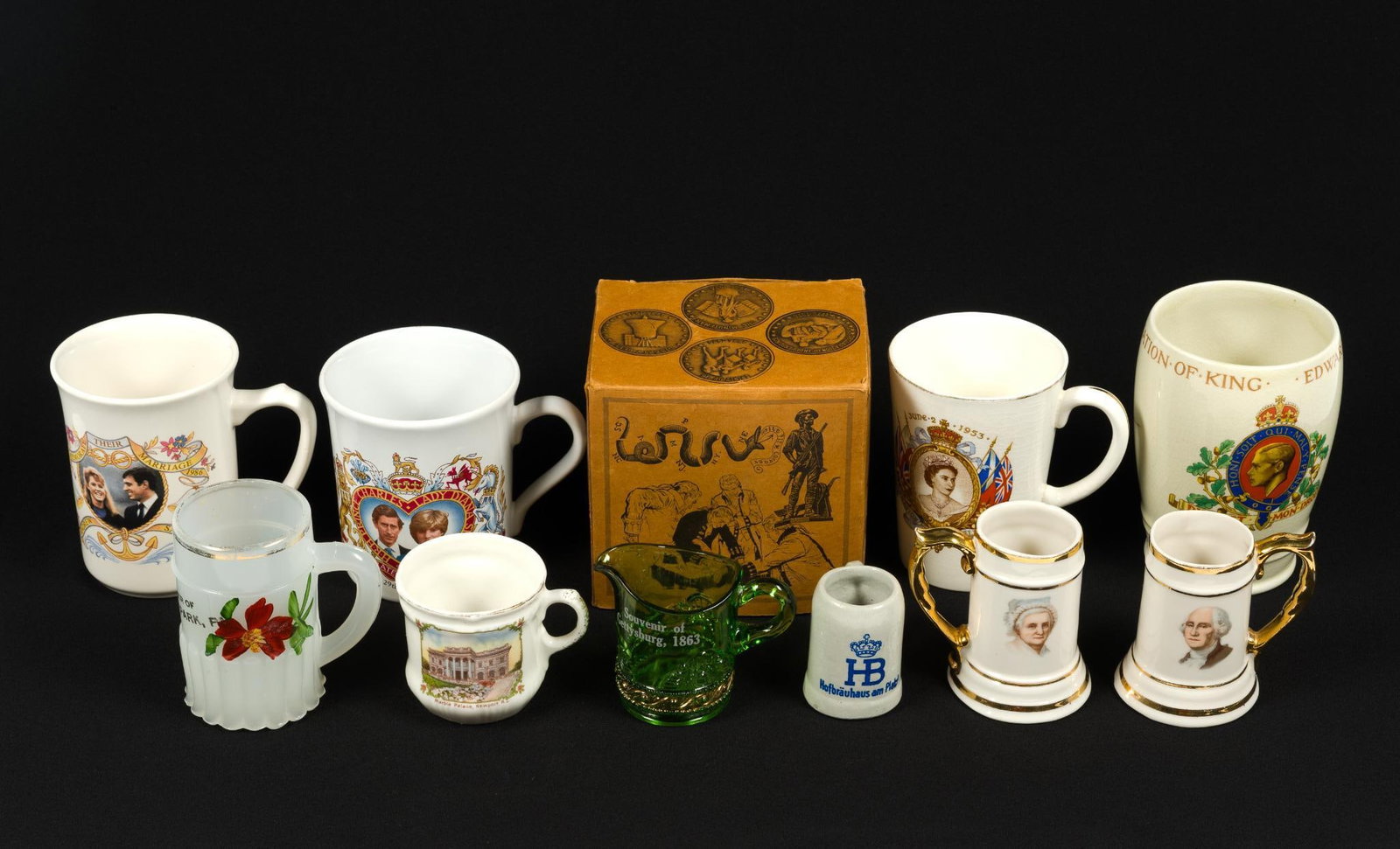 Memorabilia Mugs Incl. Queen Elizabeth II: Includes Coronation of King Edward, 1937, Coronation of Elizabeth II in 1953, Minuteman 1976 mug, Gettysburg, Martha and George Washington and others. Minuteman mug in box measures 4 - 1/2" x 4 - 1/2"