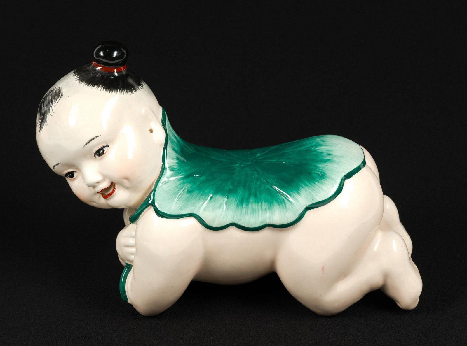 Antique Chinese Porcelain Pillow Baby: Pillow" or "headrest" babies were historically used as a hard pillow for cooling and ventilation during sleep in warm months. Measures 10" x 7" - 1/4" x 4