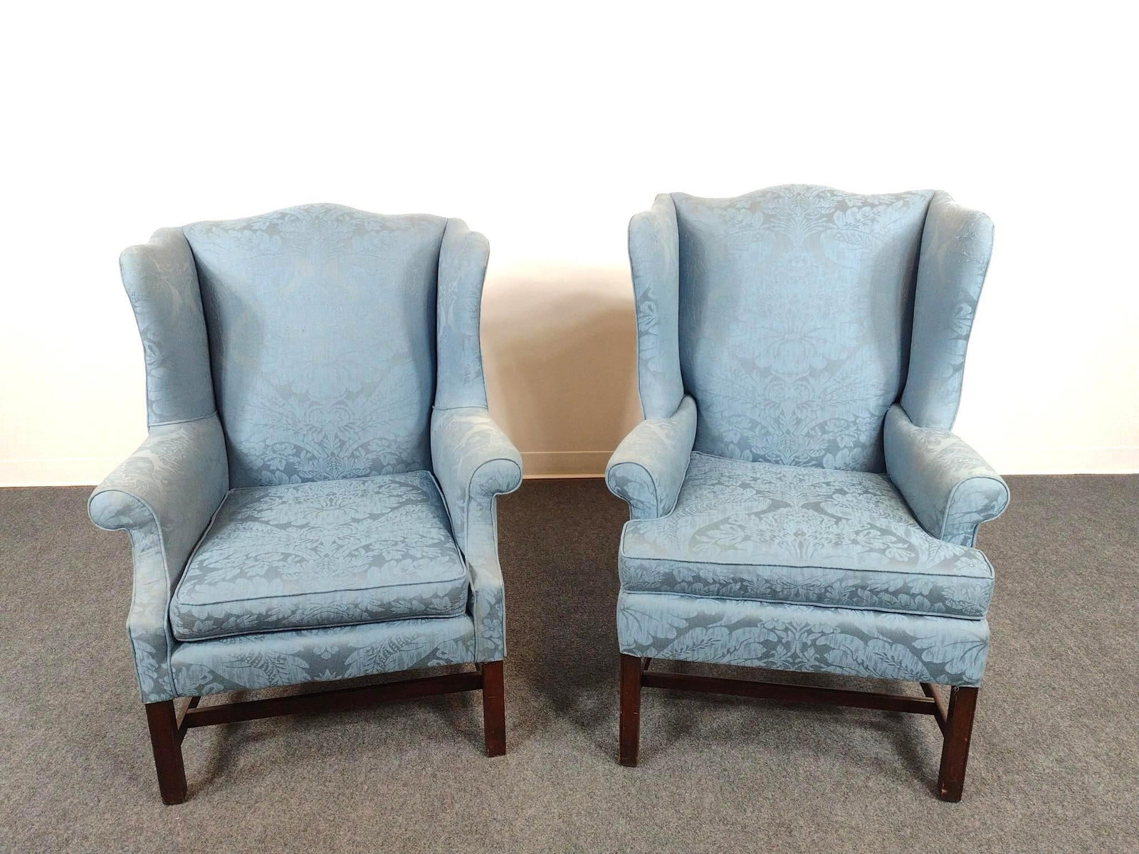 Pair Of Klassic Interiors Wing Back Chairs: 33" wide X 30-1/2" deep X 43" high. Both have some wear and scratches to upholstery.