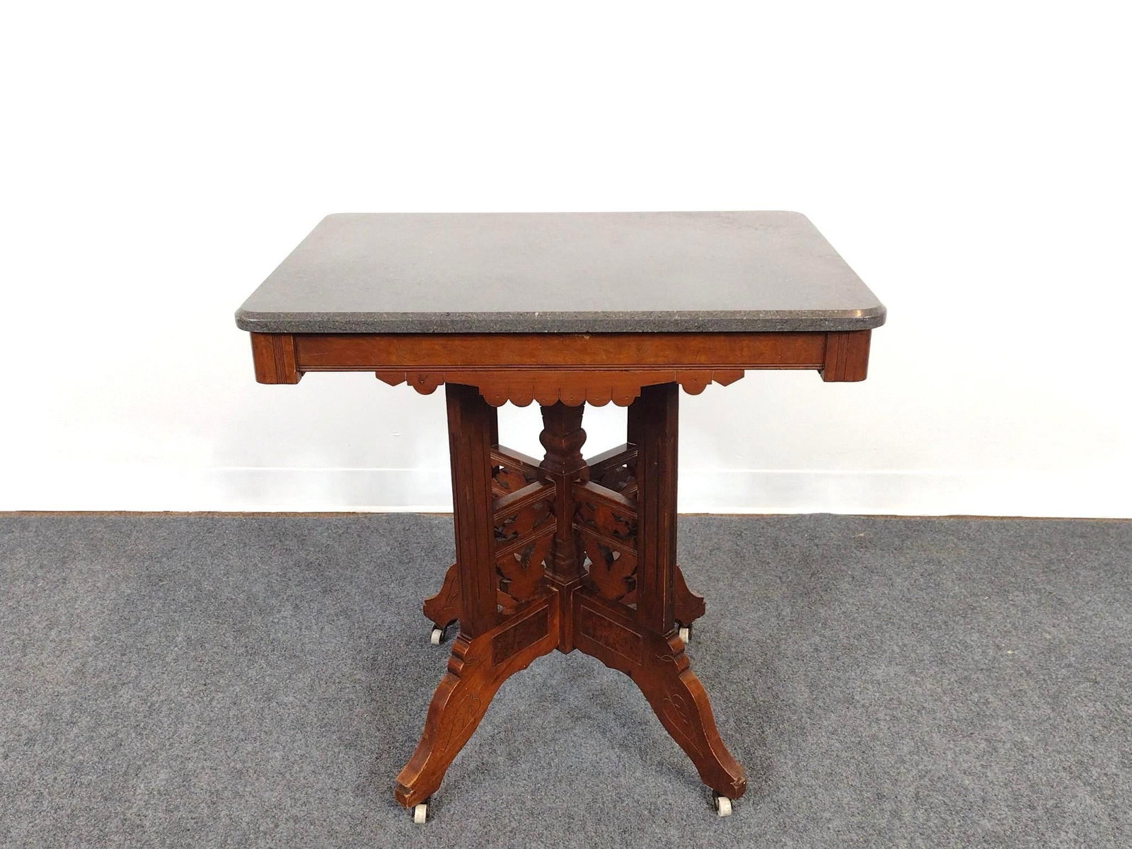 Victorian Eastlake Style Marble Top Table: 30" wide X 22" deep X 30" high.