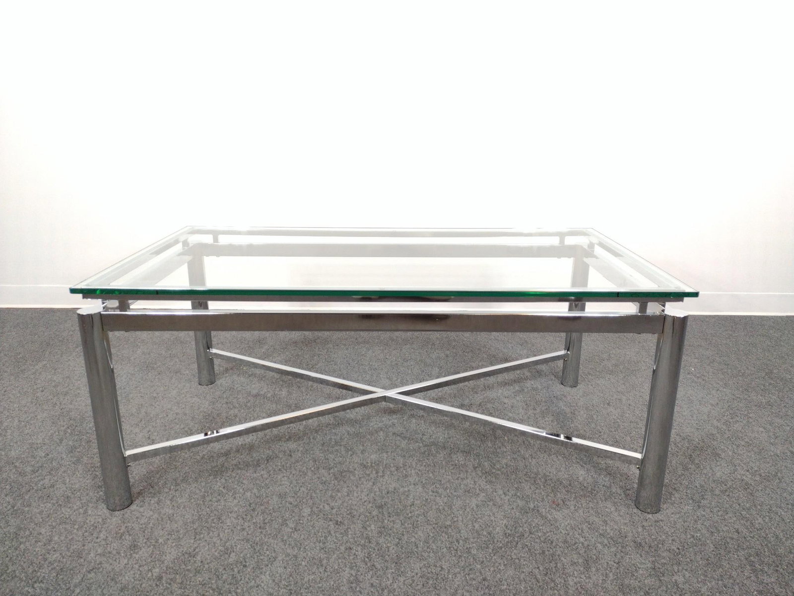 Glass Top Chrome Coffee Table: 48" wide X 26" deep X 20" high. No manufactures name found.