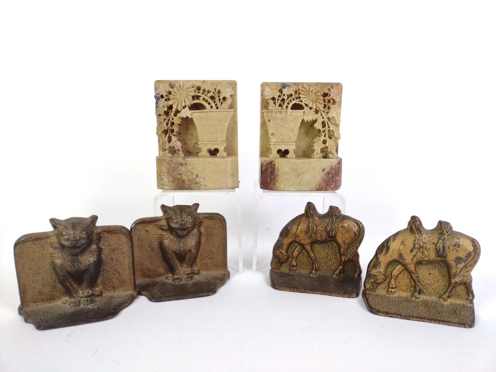 3 Pairs of Bookends Incl. Antique Cast Iron DAL Cats: Includes a pair of antique DAL (Decorative Art League) cast iron cat bookends signed and dated 1925 (4 - 1/2" x 1 - 3/4" x 3 - 3/4"), a pair of carved Chinese soap stone bookends (4" x 2" x 5") and a 
