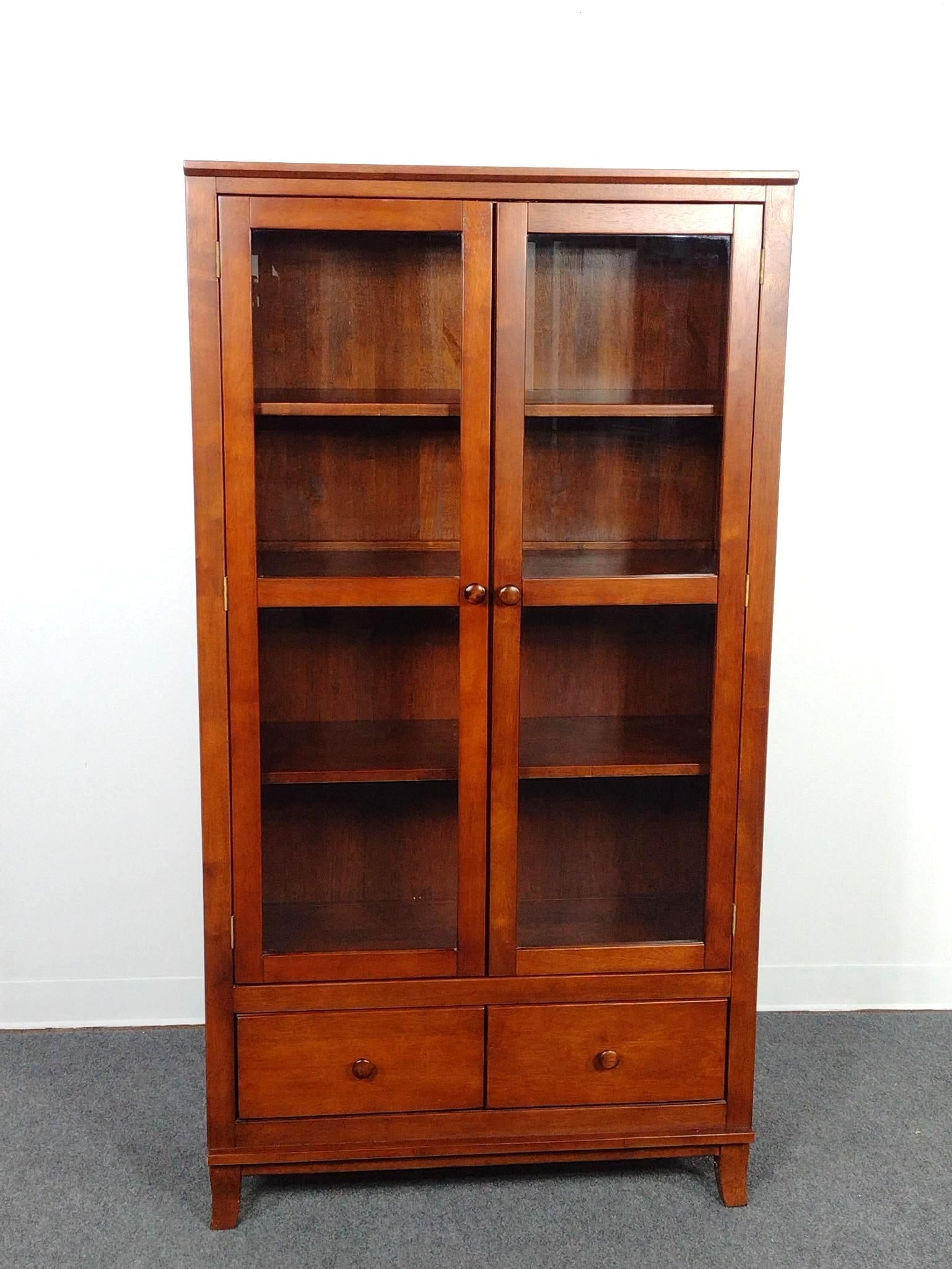 Cherry Glass Door Bookshelf Display Cabinet: 35" wide X 15" deep X 66" high. No manufactures name found.
