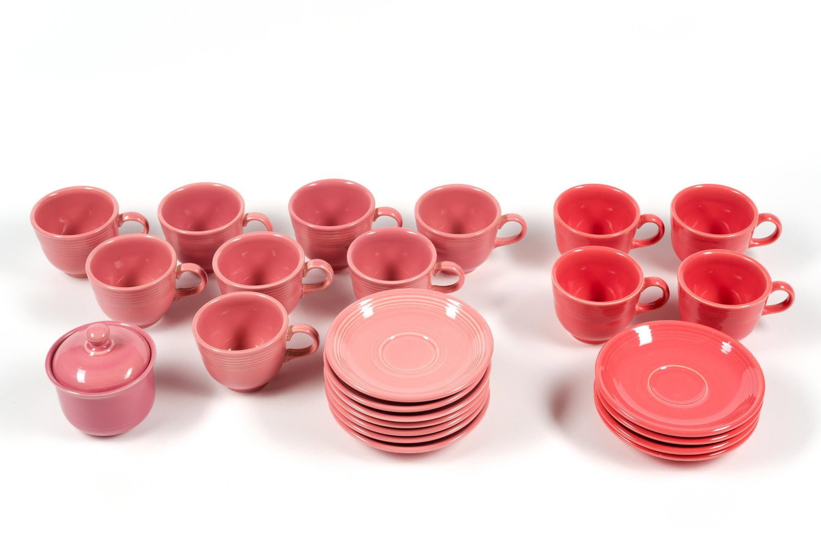 2 Sets Pink Fiesta Cups & Saucers: Also includes sugar dish. Saucers measure 6" in diameter and the cups measure 4 - 3/4" x 3 - 1/2" x 2 - 1/4".