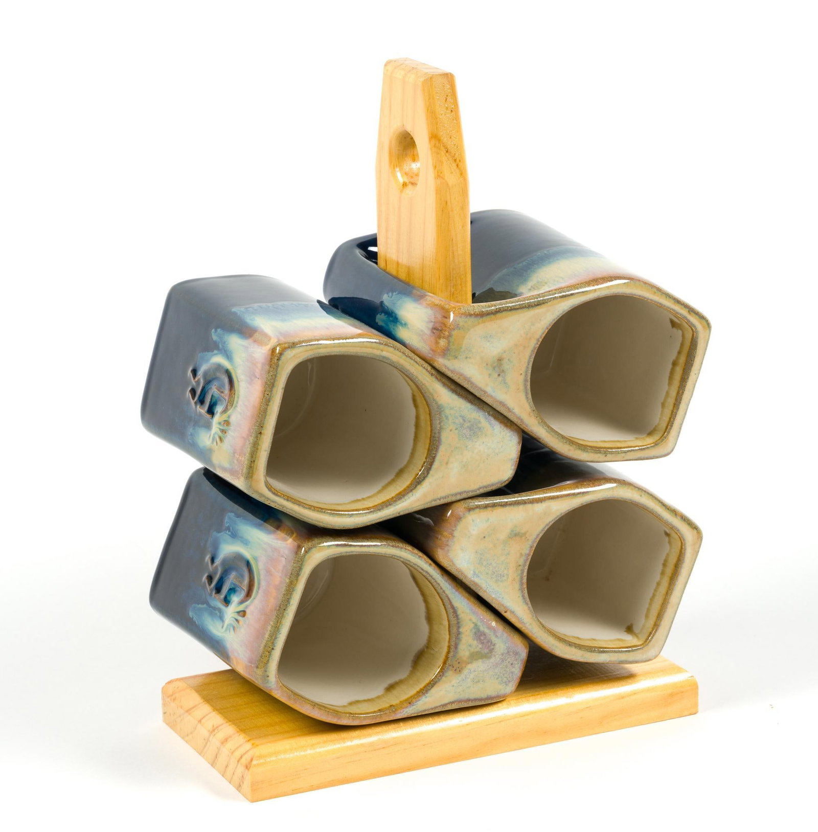 Stackable Mugtree by Padilla: Hand-finished distinctive stoneware stackable mugs made in Mexico by the Padilla Family. Mugs measure 4 - 3/4" x 3" x 4 - 1/2", wooden frame measures 8" x 4" x 11".