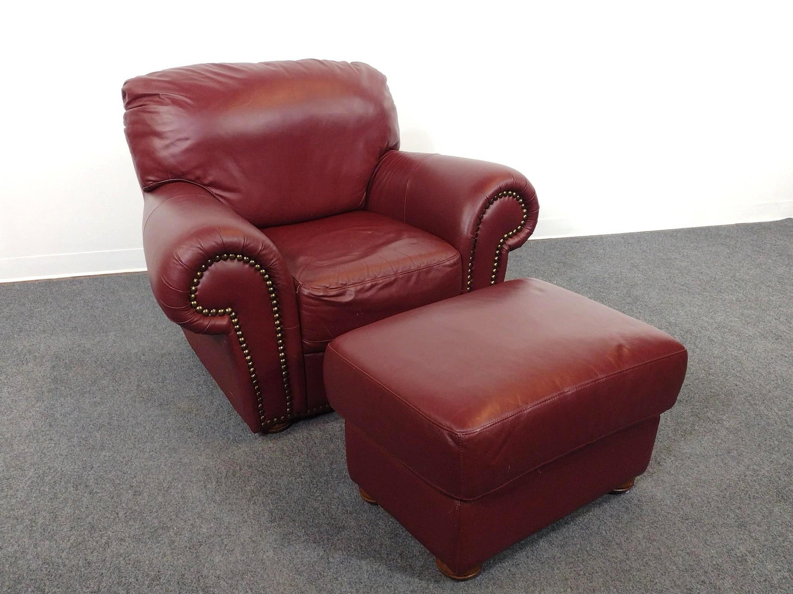 Chateau d'ax Leather Arm Chair & Ottoman: Chair 46" wide X 31" deep X 35-1/2" high. Ottoman 27" wide X 20-1/2" deep X 17-1/2" high. Both have scratches.