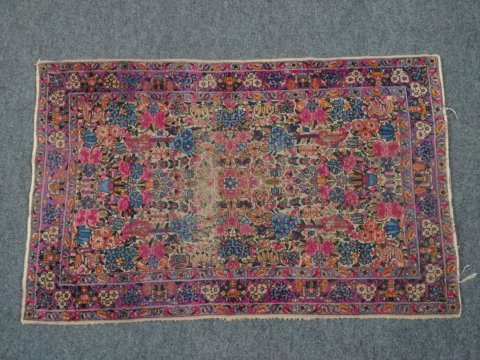 Persian Area Rug: 4'9" long X 3' wide. Has some wear. Label Made in Persia.