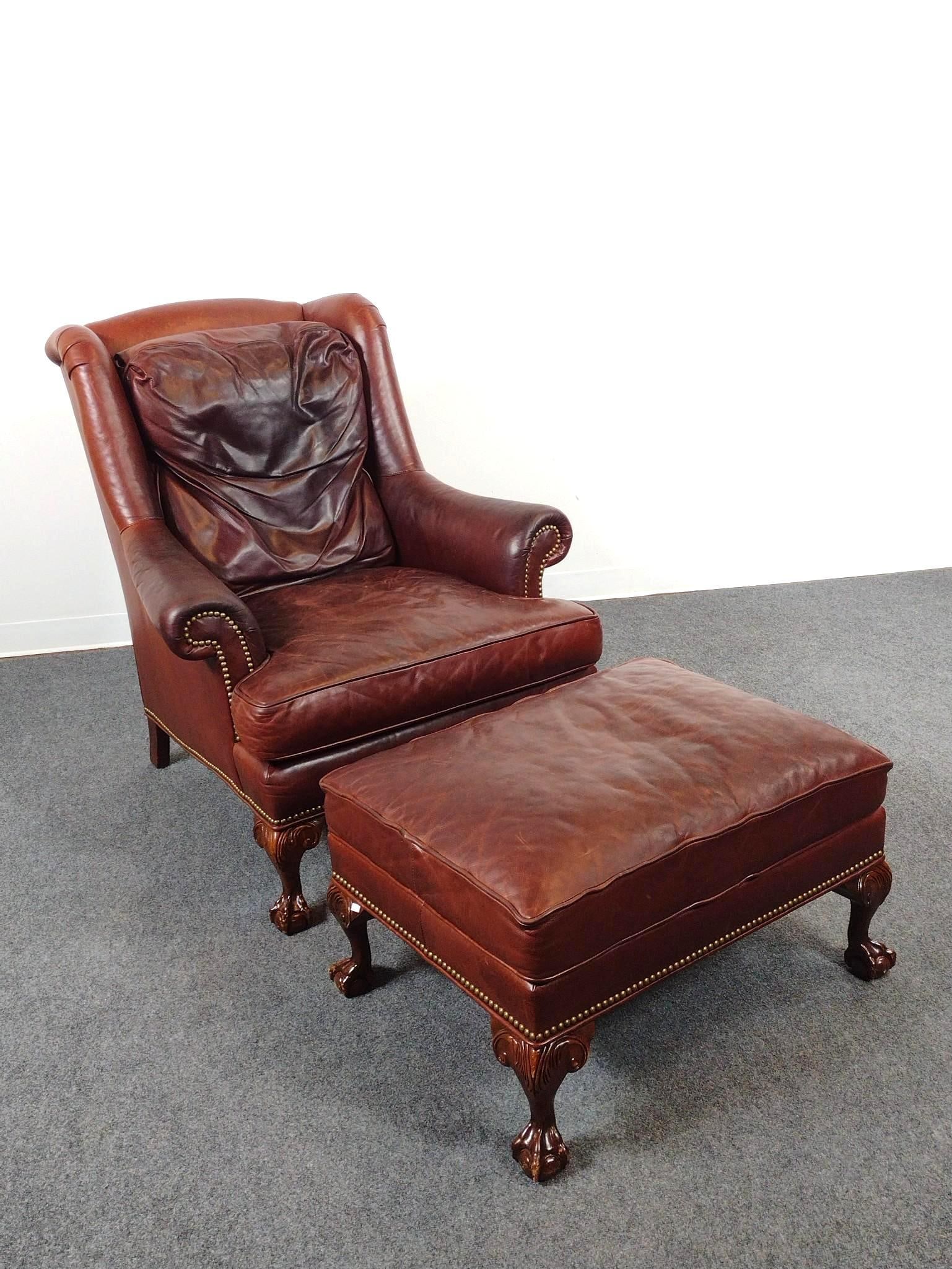 Hickory Leather Arm Chair & Ottoman: Chair 35-1/2" wide X 34" deep X 40-1/2" high. Ottoman 29" wide X 22" deep X 17-1/2" high. Both have discoloring to leather. Chair has tear at top of back cushion.