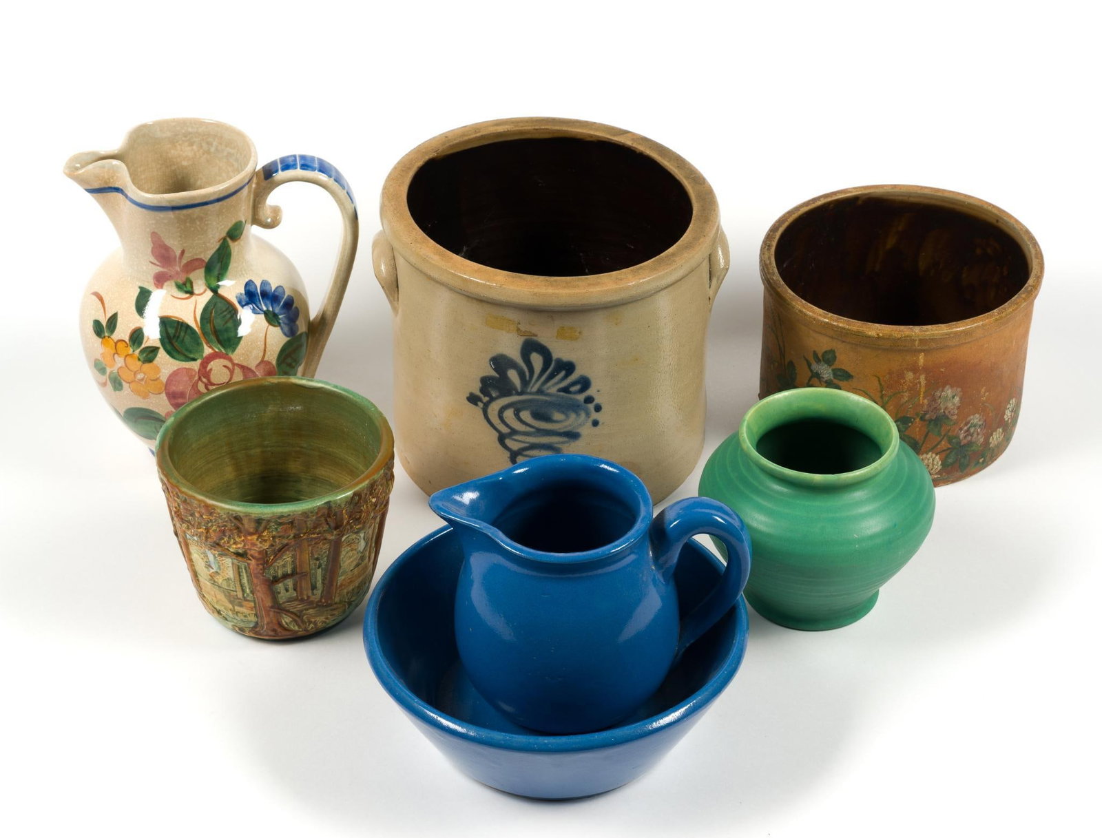 7 Vintage Stoneware and Pottery Pieces: Includes Red Wing Stoneware and others. Largest piece measures 8 - 1/2" x 7 - 1/4" x 8 - 1/2".