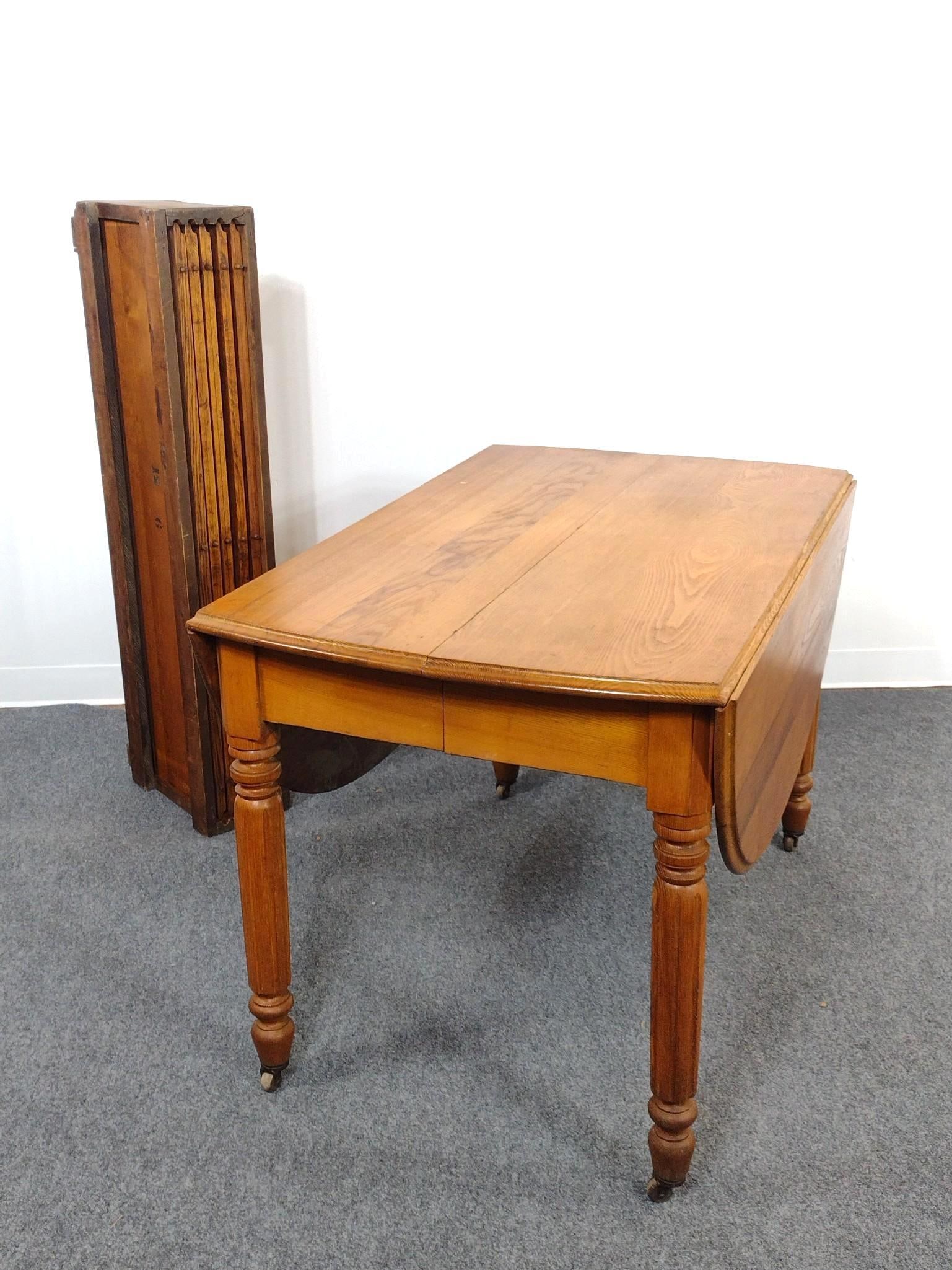 Drop Leaf Table with 5 Leaves: Table open 59", closed 28" wide X 45" deep X 29" high. Each leaf 12" wide. Table and leaves have some light scratches.