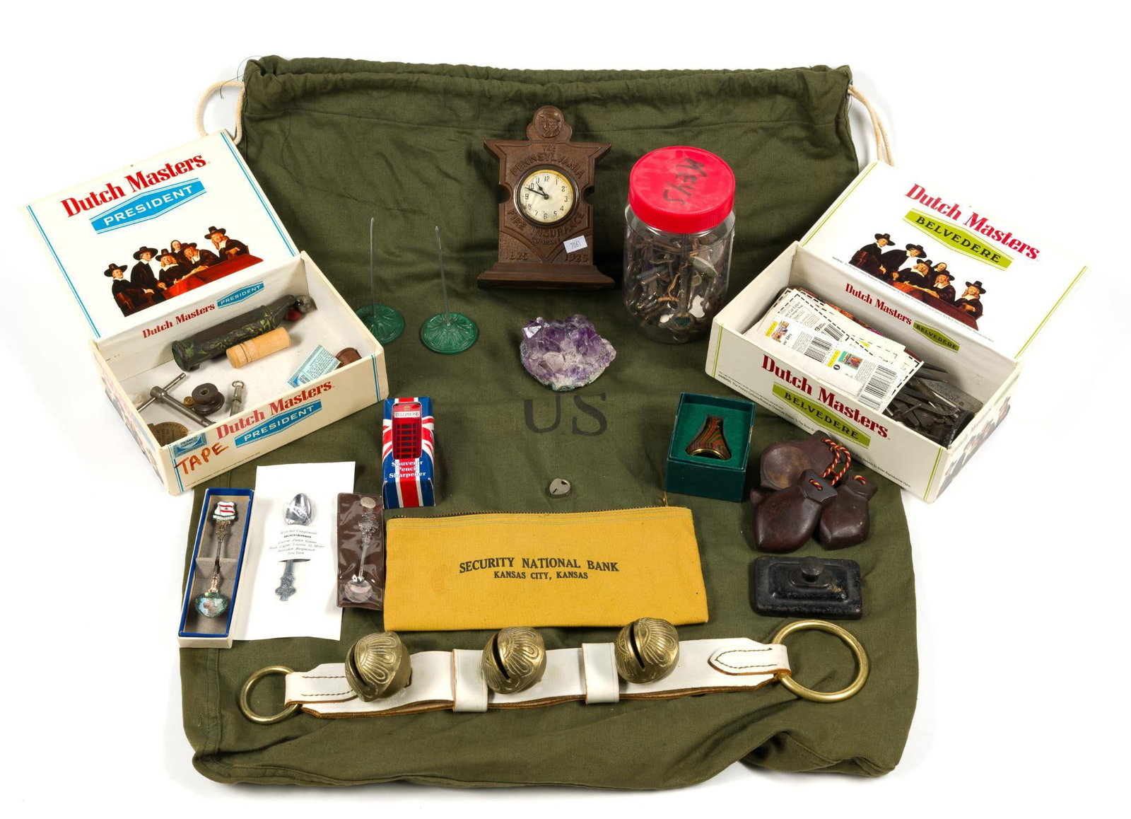 Vintage Collectibles: Includes sleigh bells meant to hang from a door knob, an assortment of antique keys, vintage tools, a kaleidoscope, 2 pairs of castanets, 3 cast iron reciept spikes, US Military barracks bag and more!