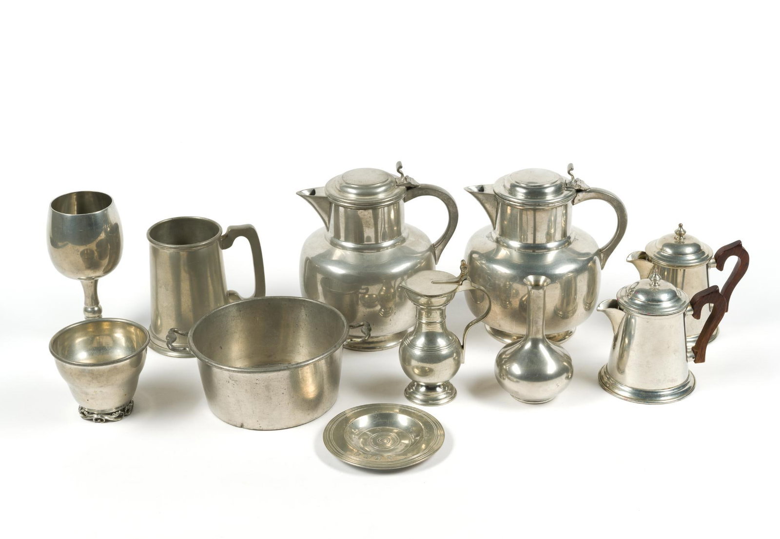 Antique Pewter: Includes plates, mugs, teapots, goblets and bowls. Smallest plate is 4 - 1/2" in diameter, and the largest teapot measures 7" x 5 - 1/2" x 8".
