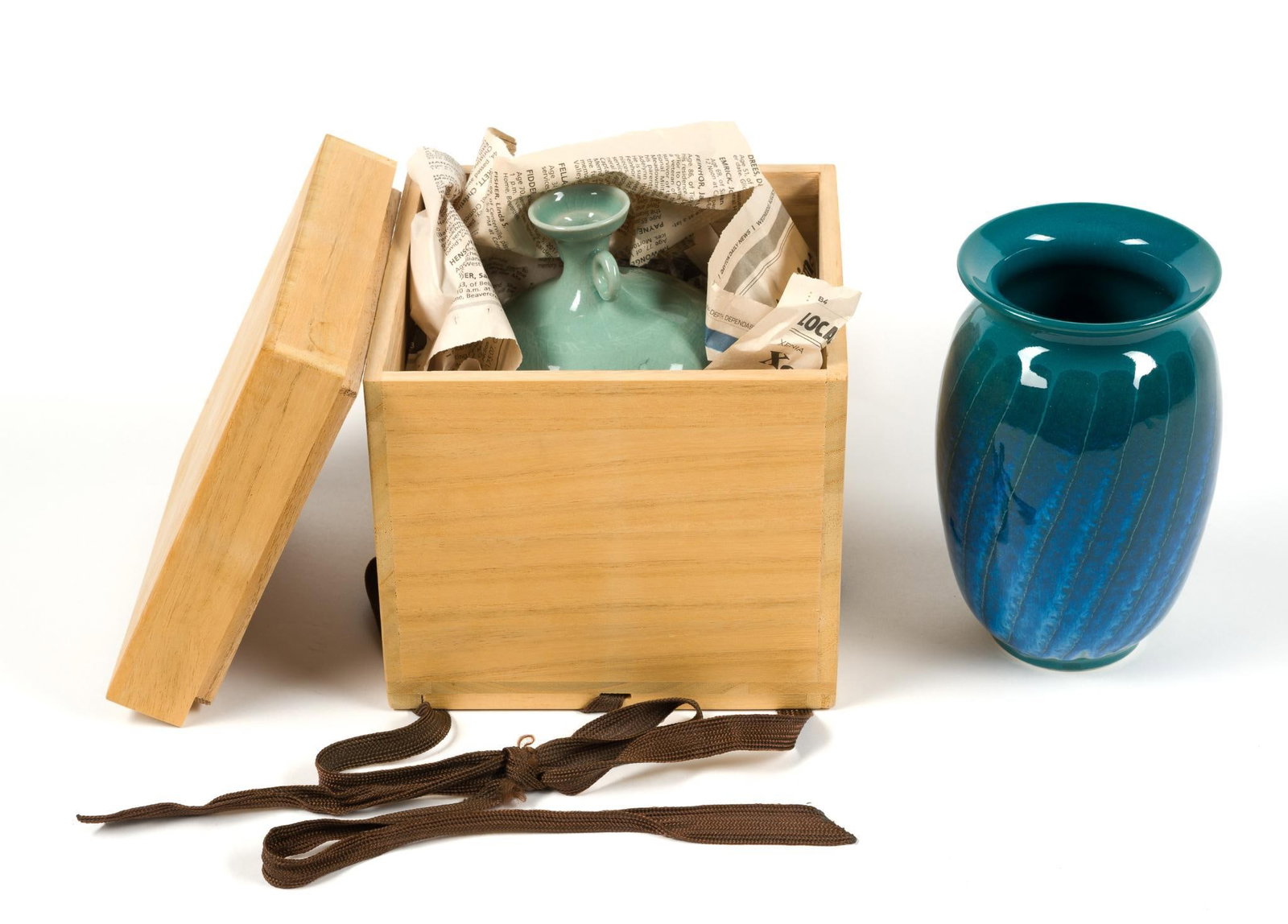 2 Art Pottery Vases: Includes a vase by Itsuko Zenitani which measures 4" x 4" x 6 - 1/2", and a vintage Korean Celadon cracked floral vase the measures 4" x 4" x 5 - 1/4" and is signed on the bottom.