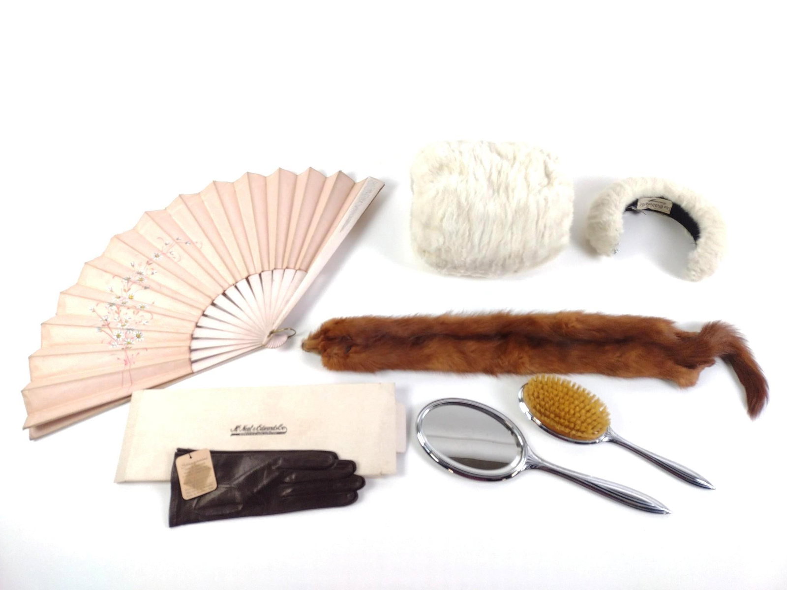 Vintage Fashion Accessories: Including Stanganani gloves, McNeal & Edwards elbow length white gloves, a "Furs by Carin" mink clip, a hand warmer and head cover by The Gidding Co. and a vintage art-deco vanity mirror and brush set