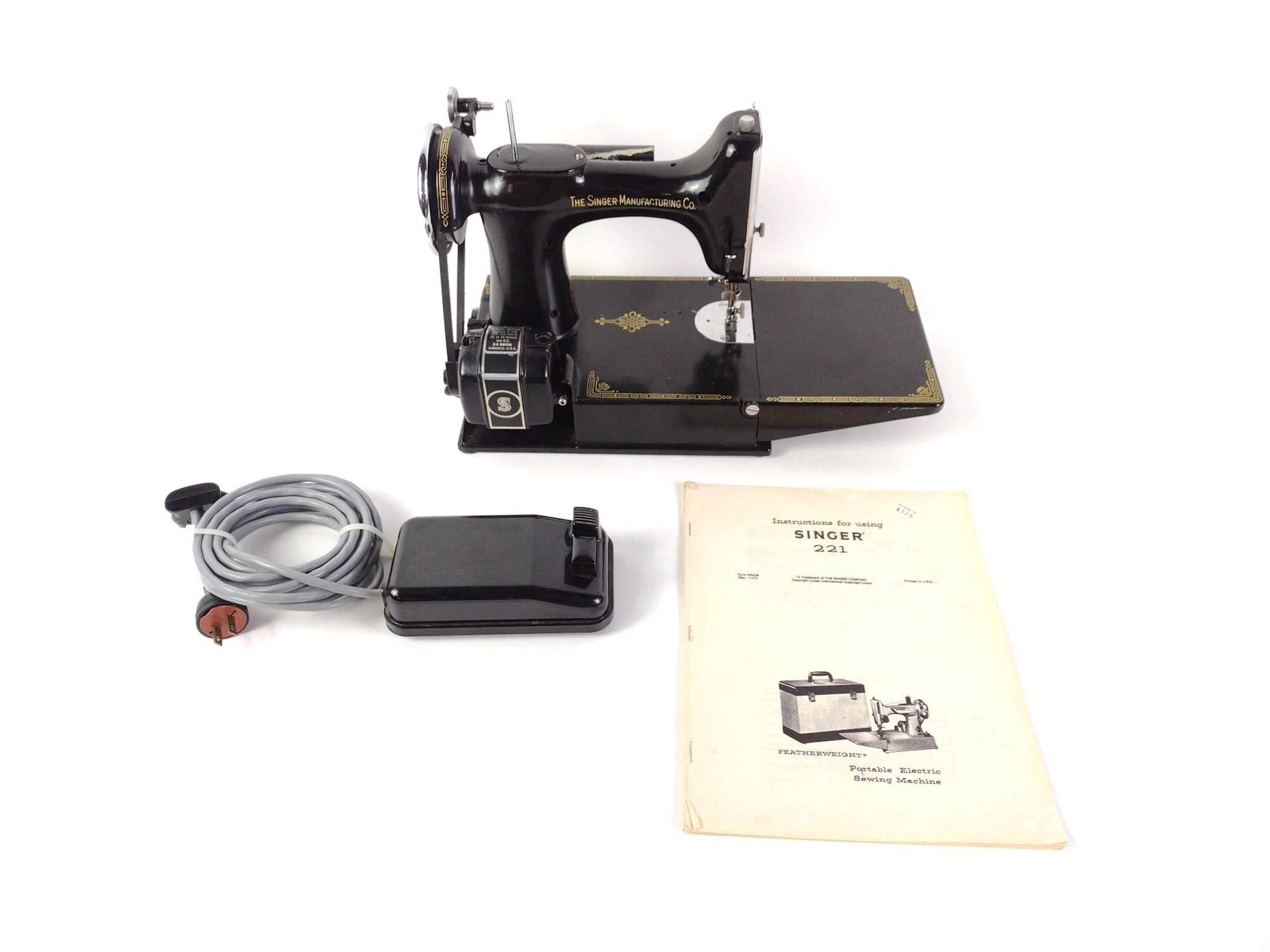 Singer 221 Sewing Machine: 15-1/2" wide X 7" deep X 9-1/4" high. Untested.